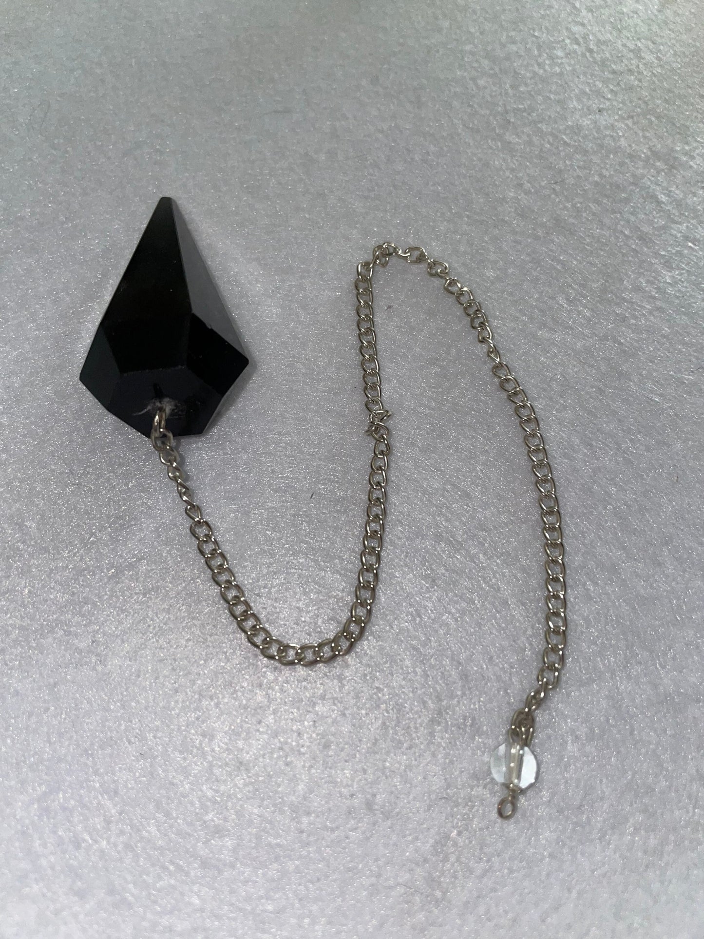 Beautiful Black Obsidian Pendulum is 1.75” and with chain is 9”.25”