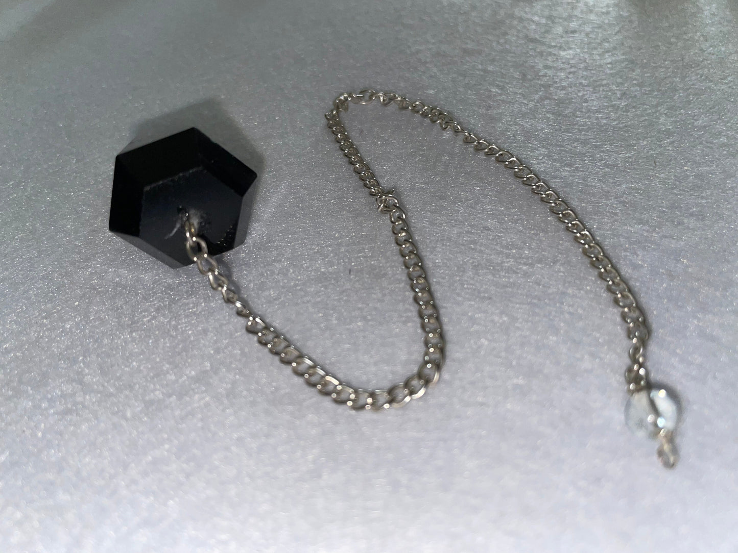 Beautiful Black Obsidian Pendulum is 1.75” and with chain is 9”.25”