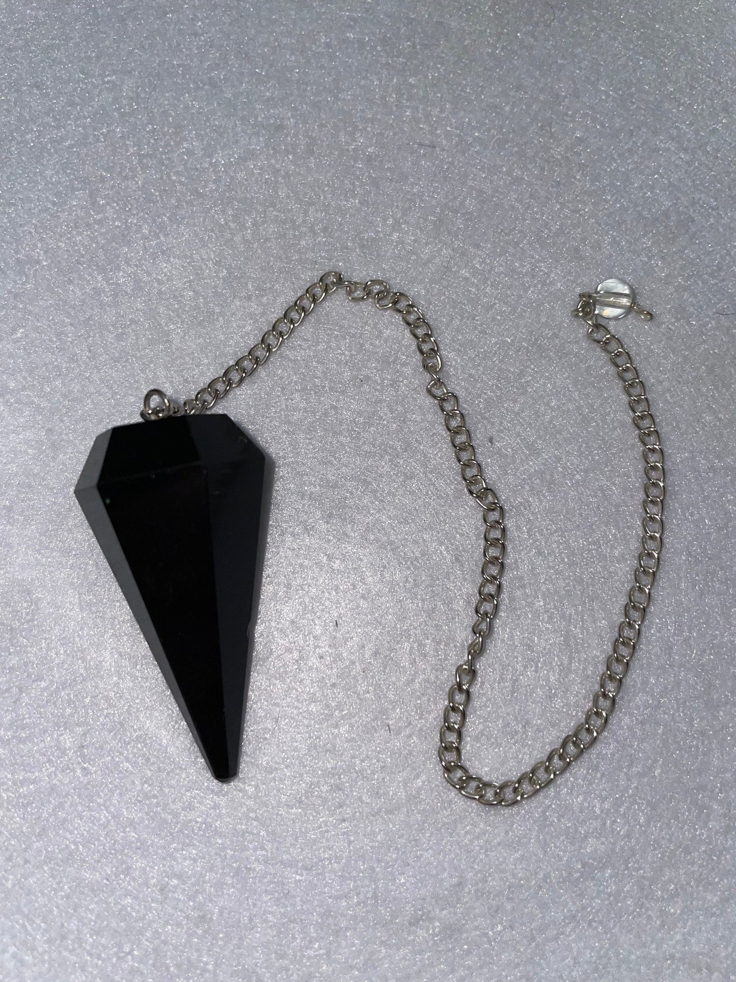 Beautiful Black Obsidian Pendulum is 1.75” and with chain is 9”.25”