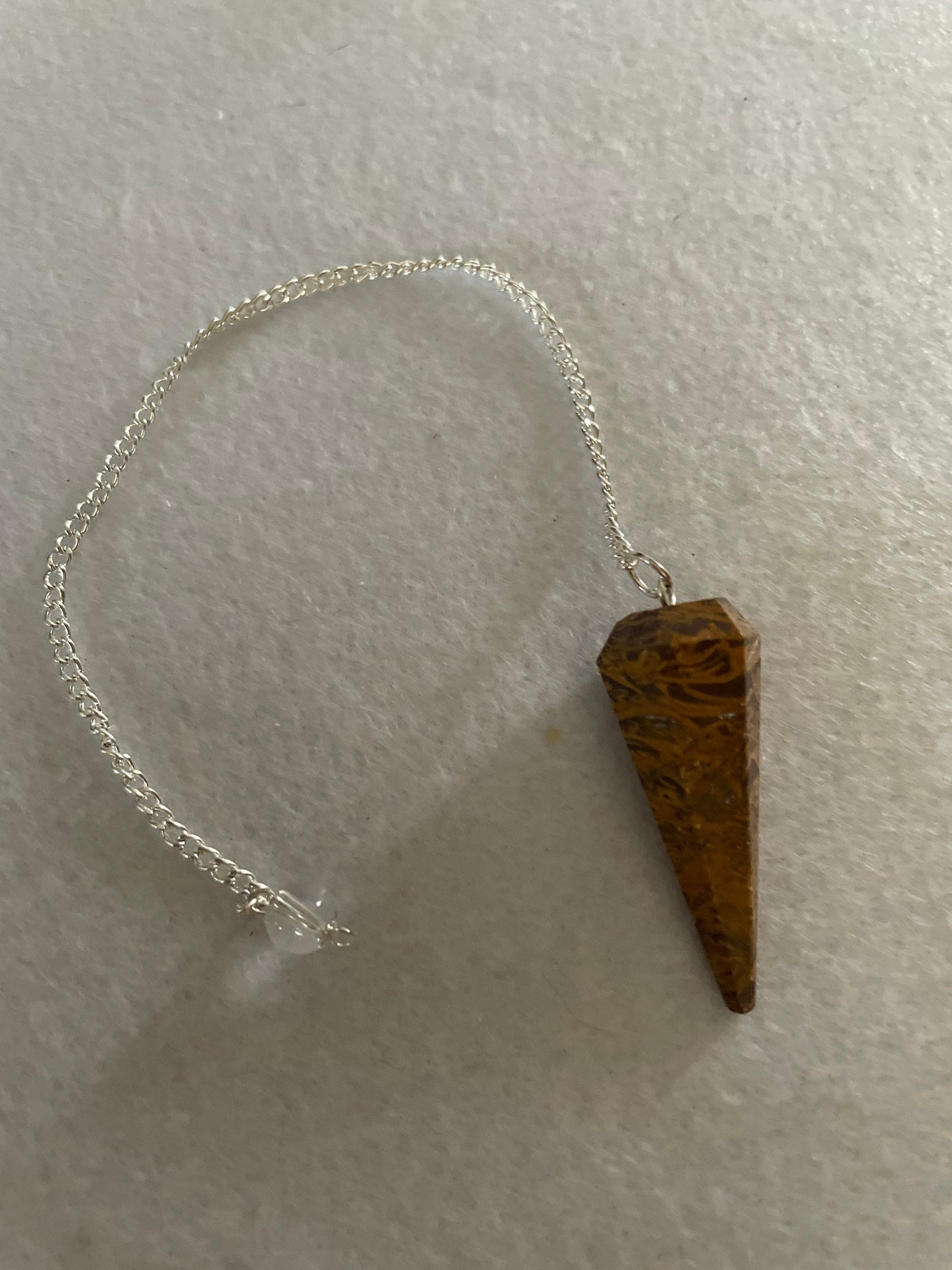 beautiful Yellow Jasper Pendulum is 1.50” and with the chain it is approximately 8”