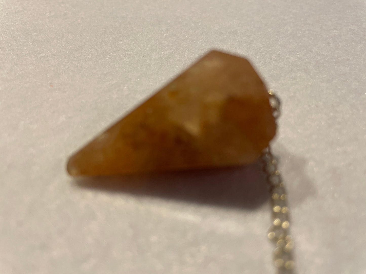 Beautiful Carnelian Pendulum is 1.25” and with the chain it is approximately 9.5”