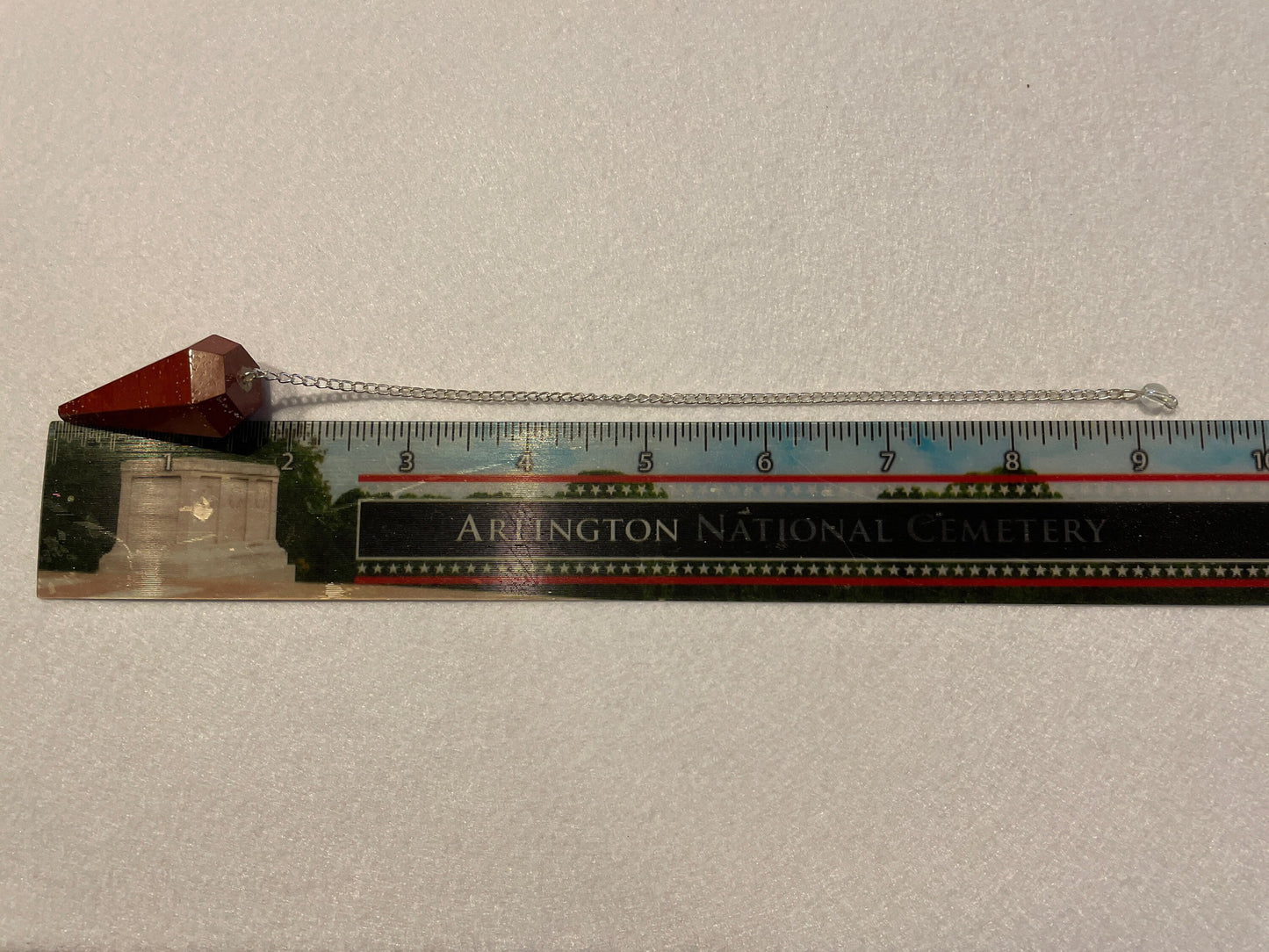 Beautiful Red Jasper Pendulum is 1.75” with chain 9.25”.