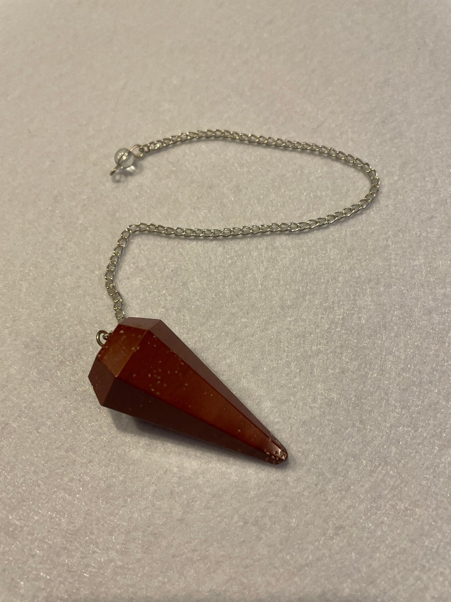 Beautiful Red Jasper Pendulum is 1.75” with chain 9.25”.
