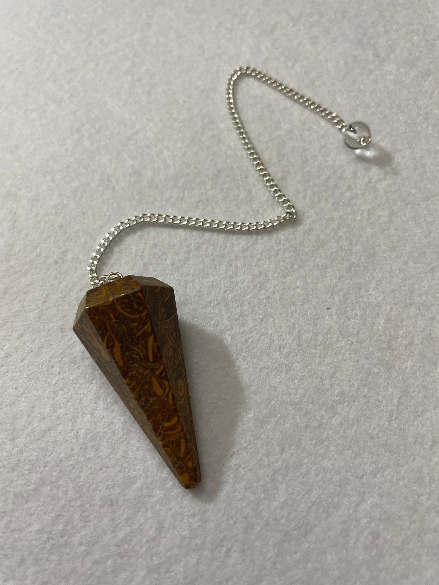 This Mariam Jasper Pendulum is 1.50” and with the chain is 8.25”.