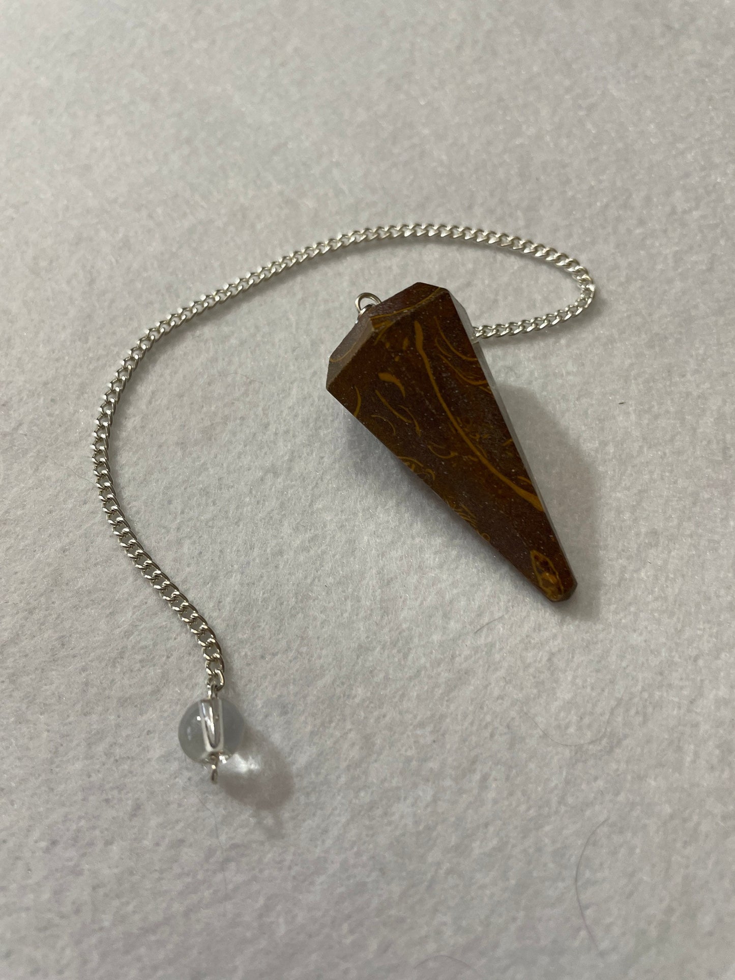This Mariam Jasper Pendulum is 1.50” and with the chain is 8.25”.