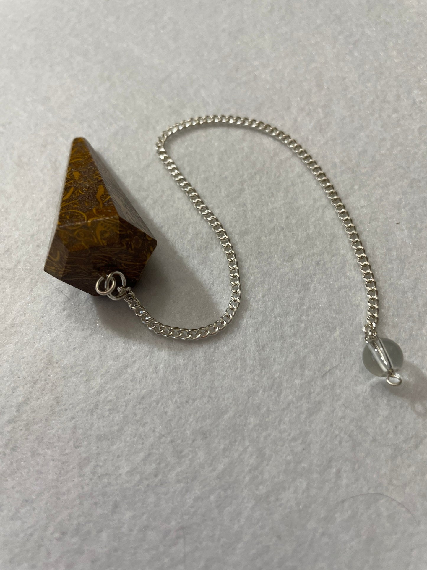 This Mariam Jasper Pendulum is 1.50” and with the chain is 8.25”.