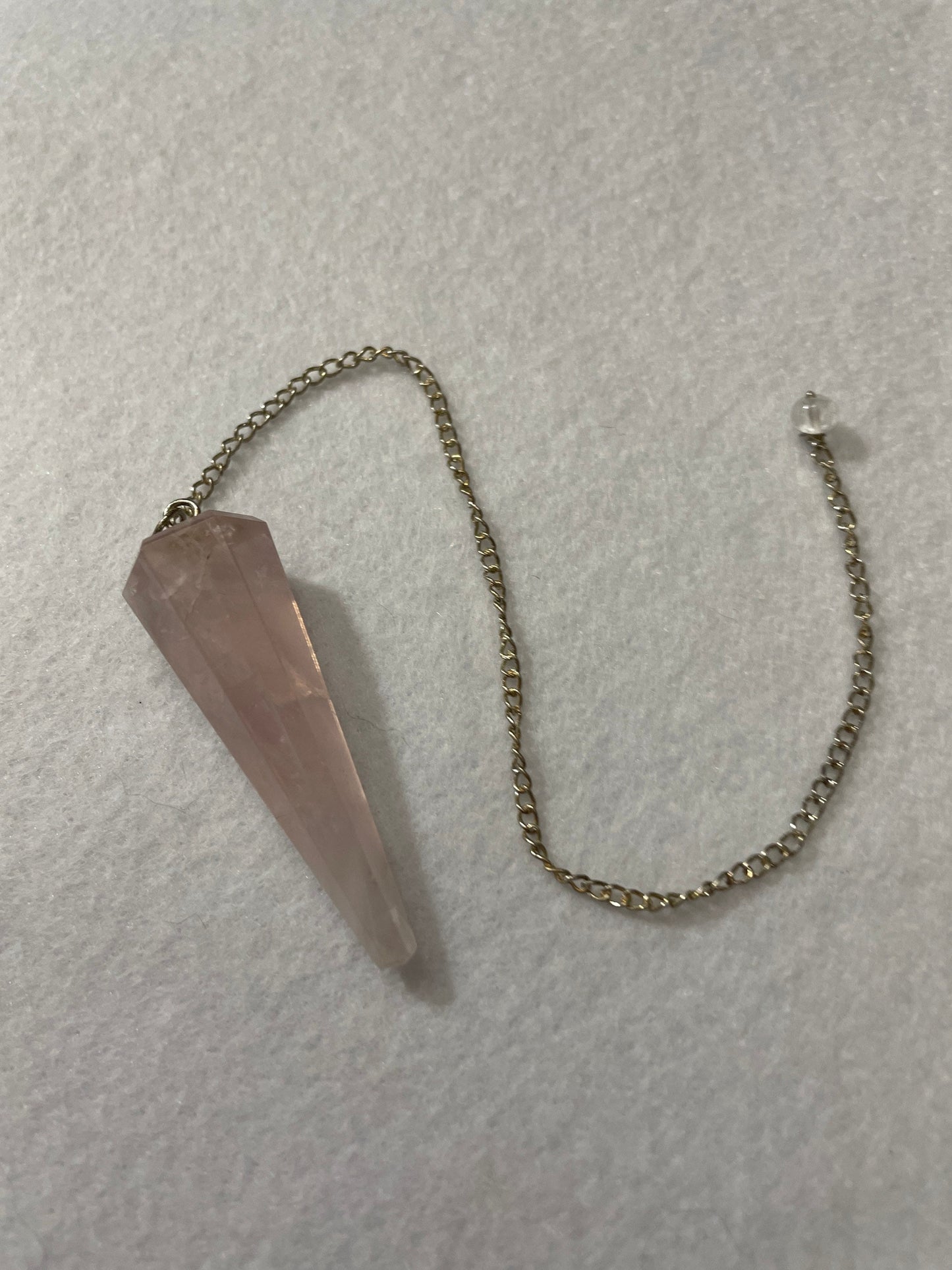 This beautiful Rose Quartz Pendulum is 1.75” and with chain is 8.75”