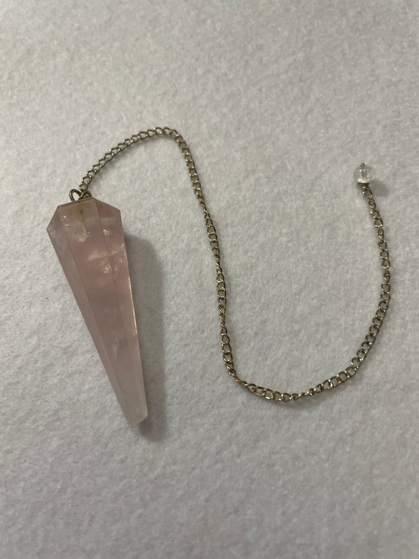 This beautiful Rose Quartz Pendulum is 1.75” and with chain is 8.75”