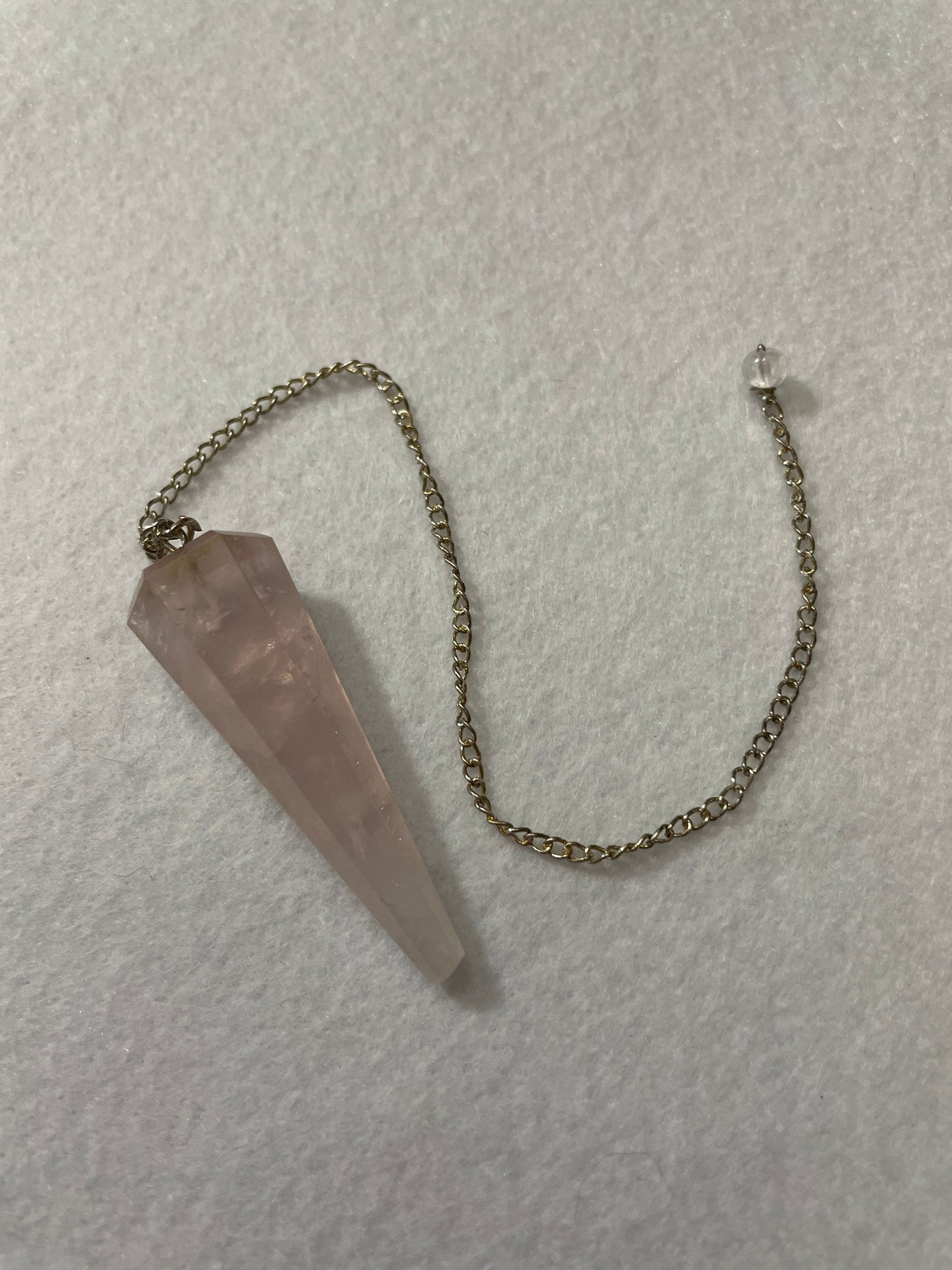 This beautiful Rose Quartz Pendulum is 1.75” and with chain is 8.75”