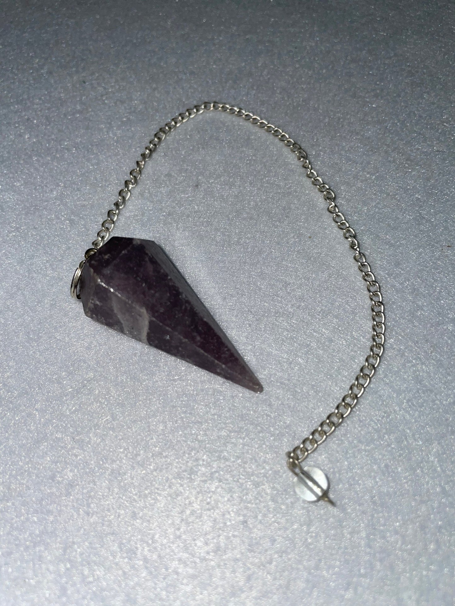 Lovely healing Amethyst Pendulum is 1.65” and with chain is 9.5”.