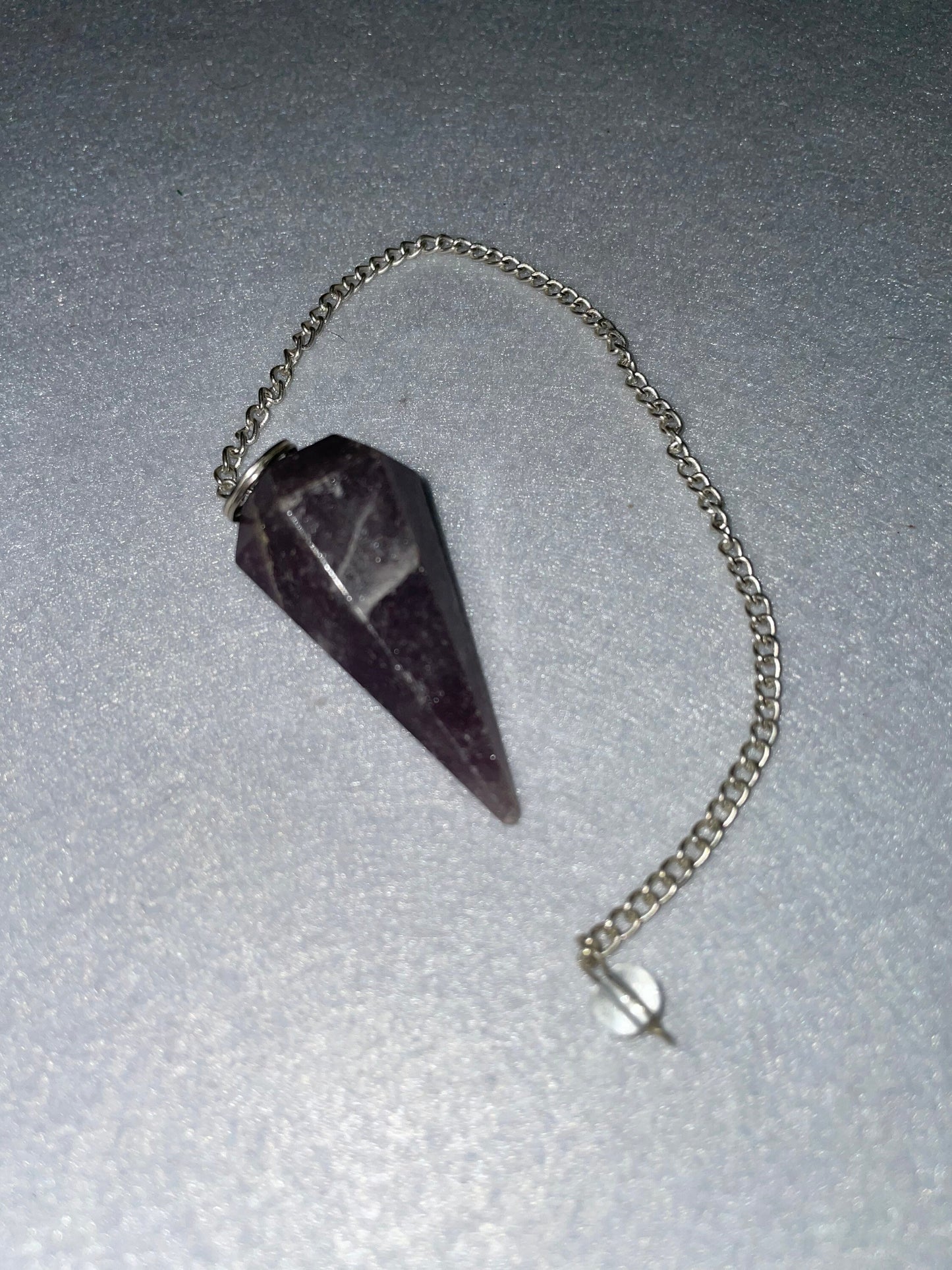 Lovely healing Amethyst Pendulum is 1.65” and with chain is 9.5”.