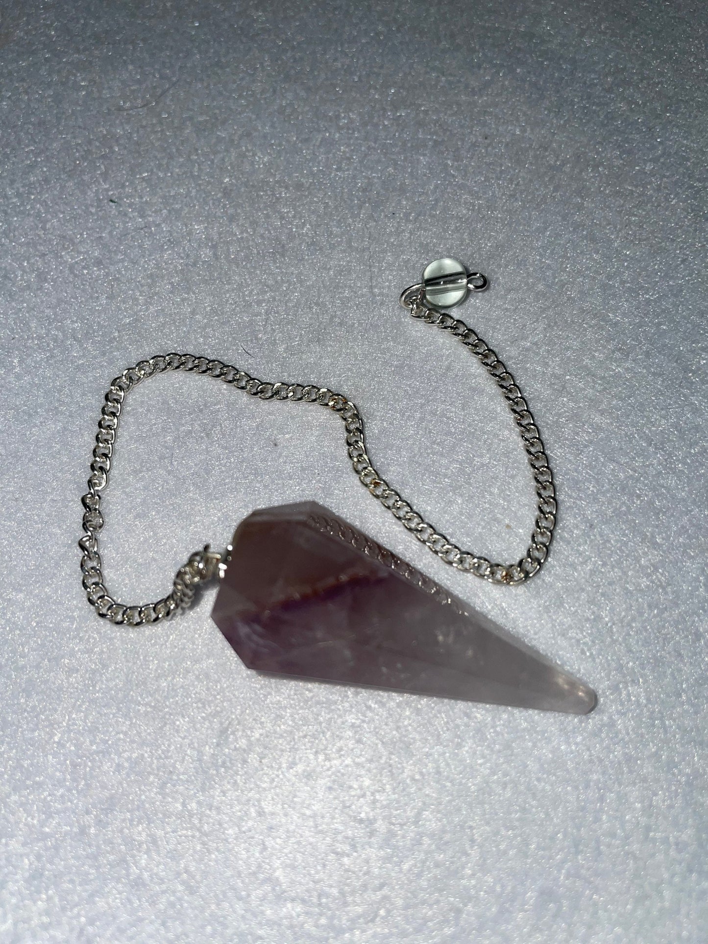 Amethyst Pendulum is 1.75” and with chain is 8.75”