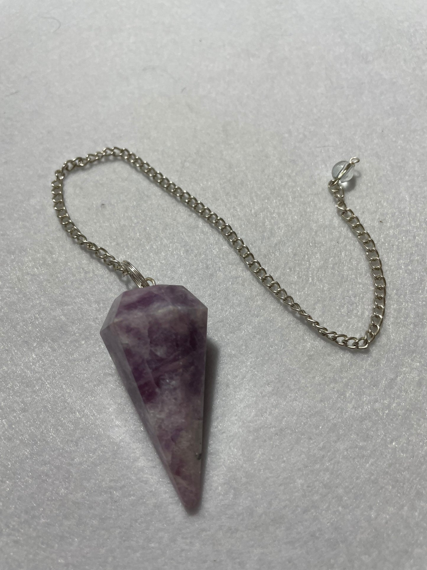 Gorgeous Lepidolite Pendulum is 1.75” and with chain is 9.25”
