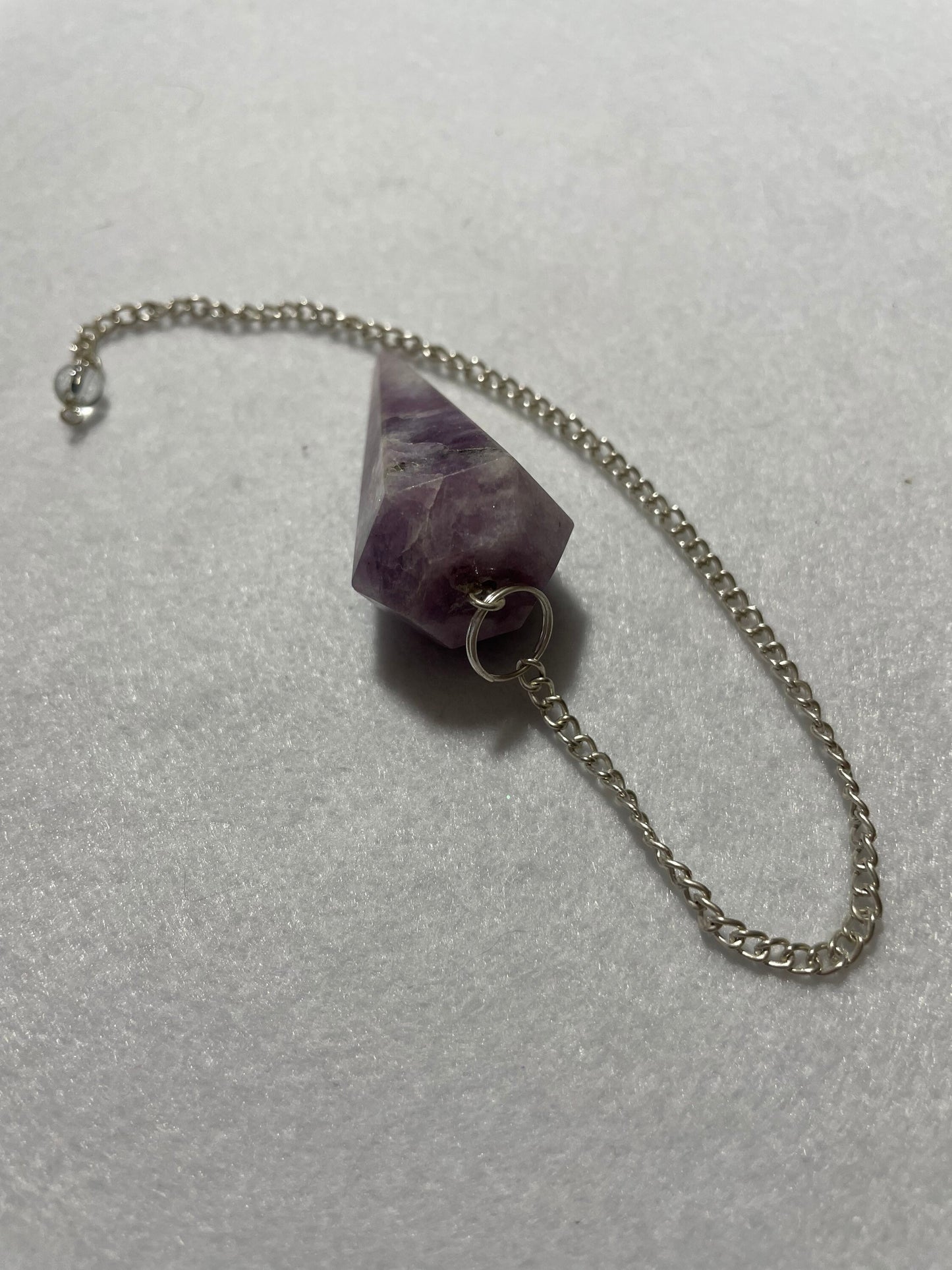 Gorgeous Lepidolite Pendulum is 1.75” and with chain is 9.25”