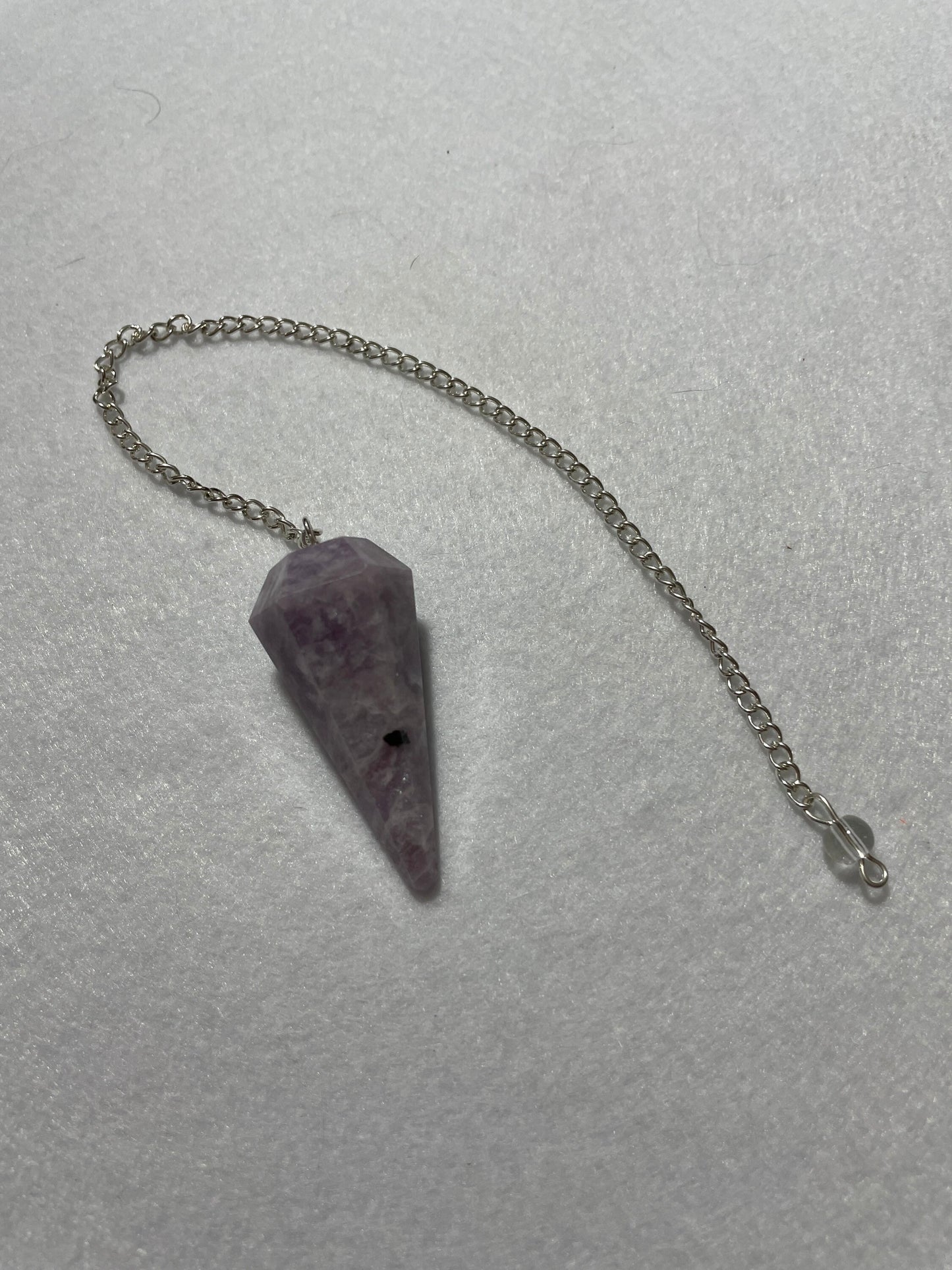 This beautiful Lepidolite Pendulum is 1.65” and with chain is 9”