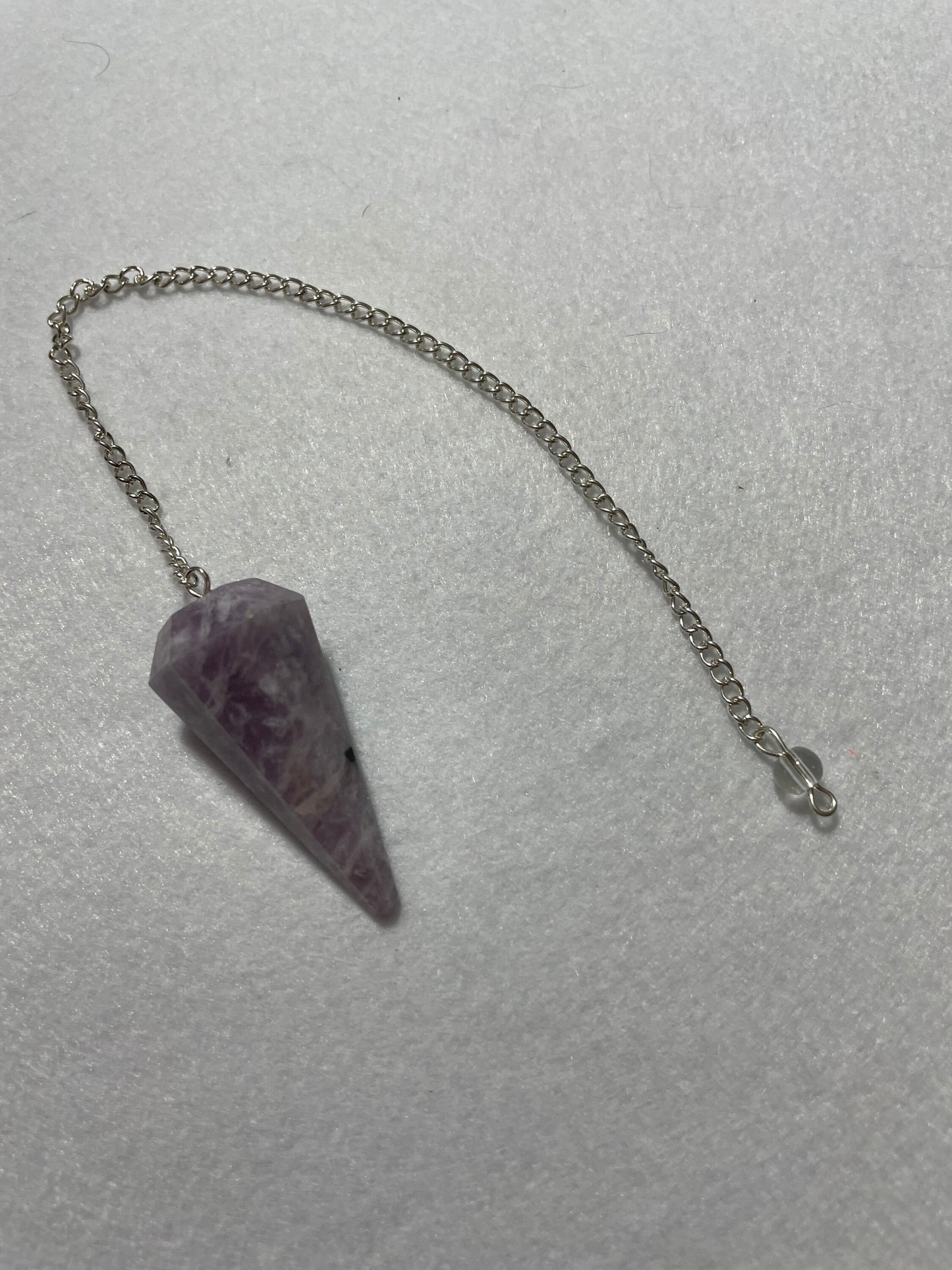 This beautiful Lepidolite Pendulum is 1.65” and with chain is 9”