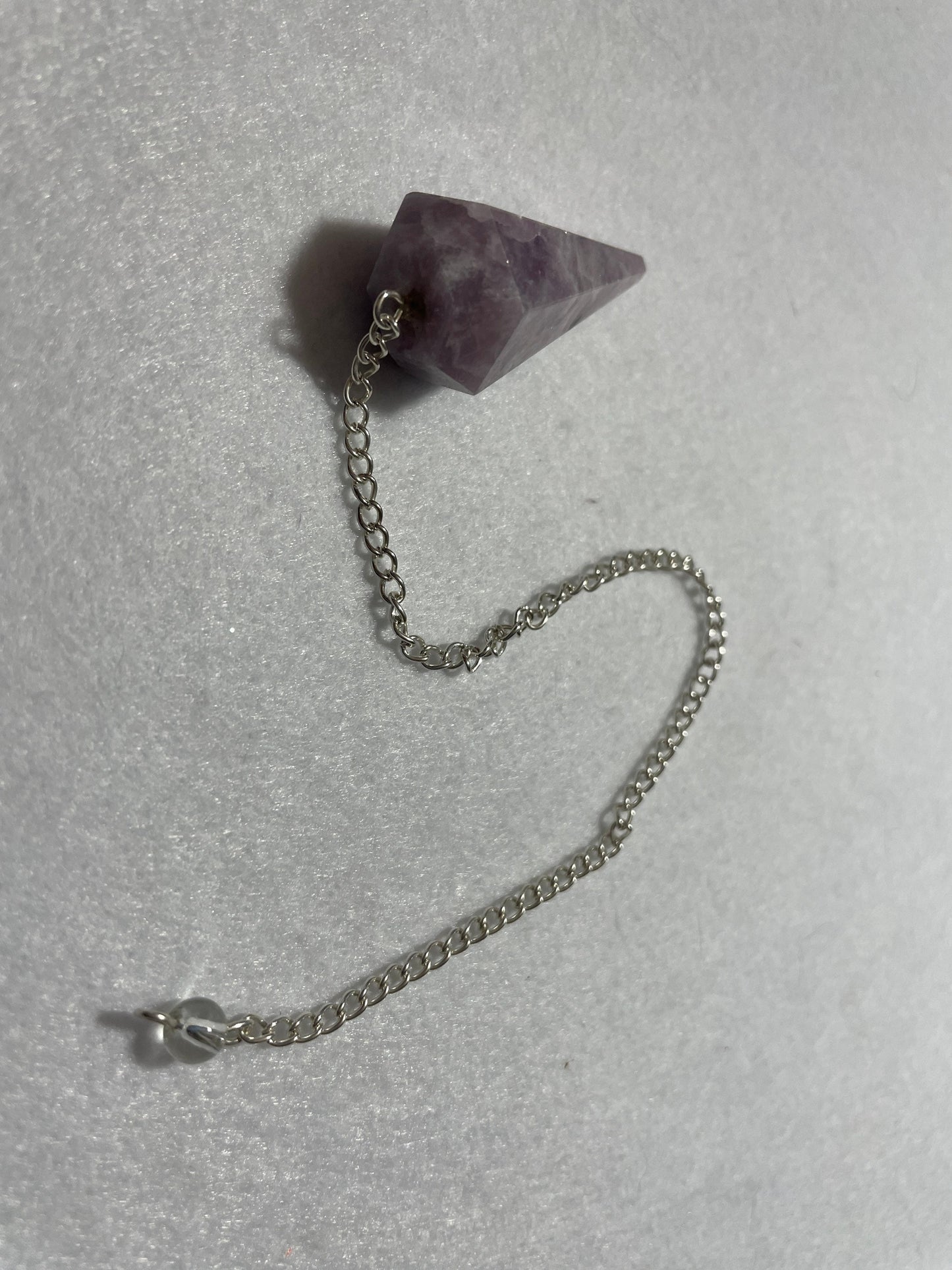 This beautiful Lepidolite Pendulum is 1.65” and with chain is 9”