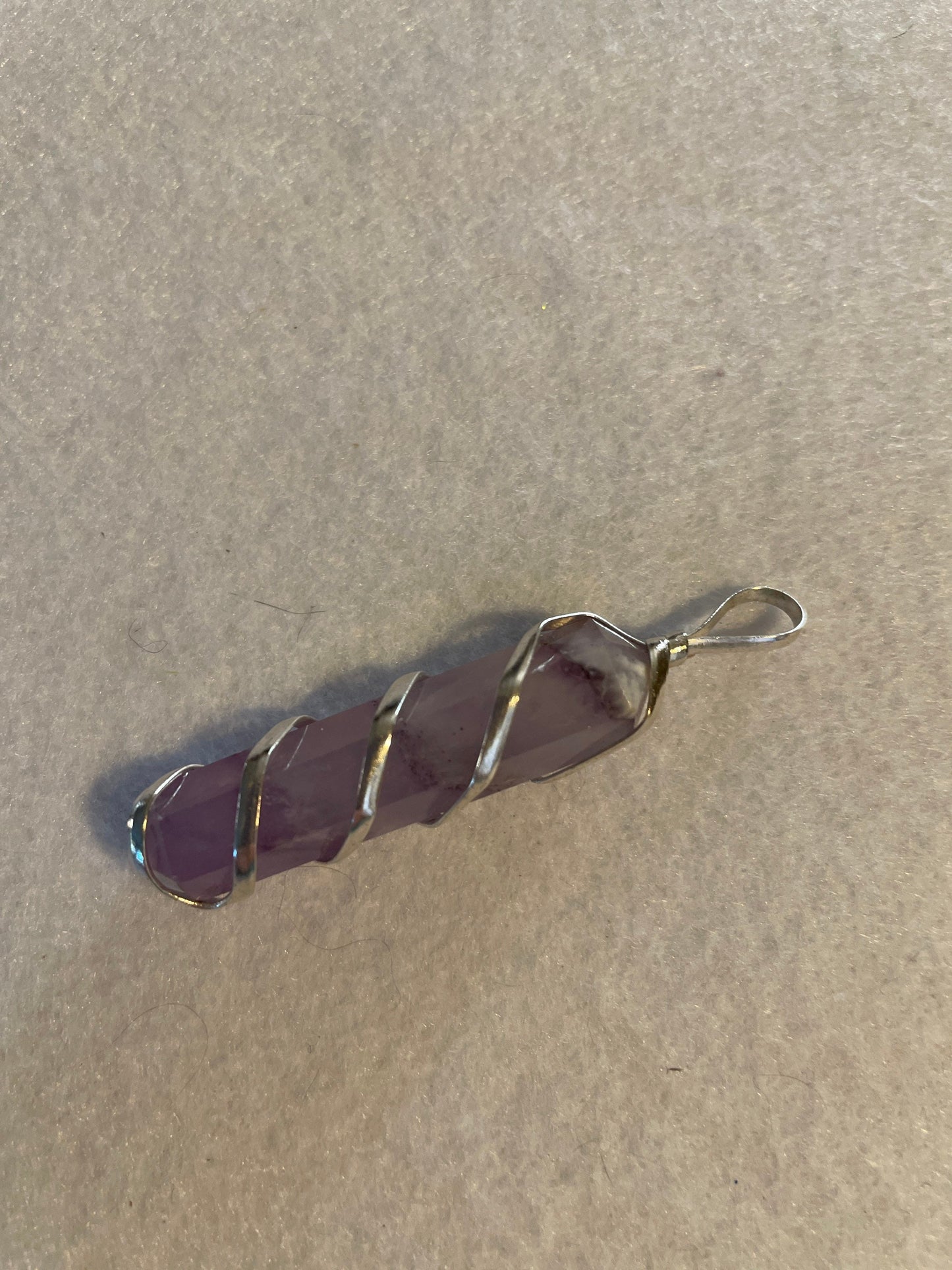 Gorgeous Amethyst Point Pendant is 1.5” and is wrapped in precious silver