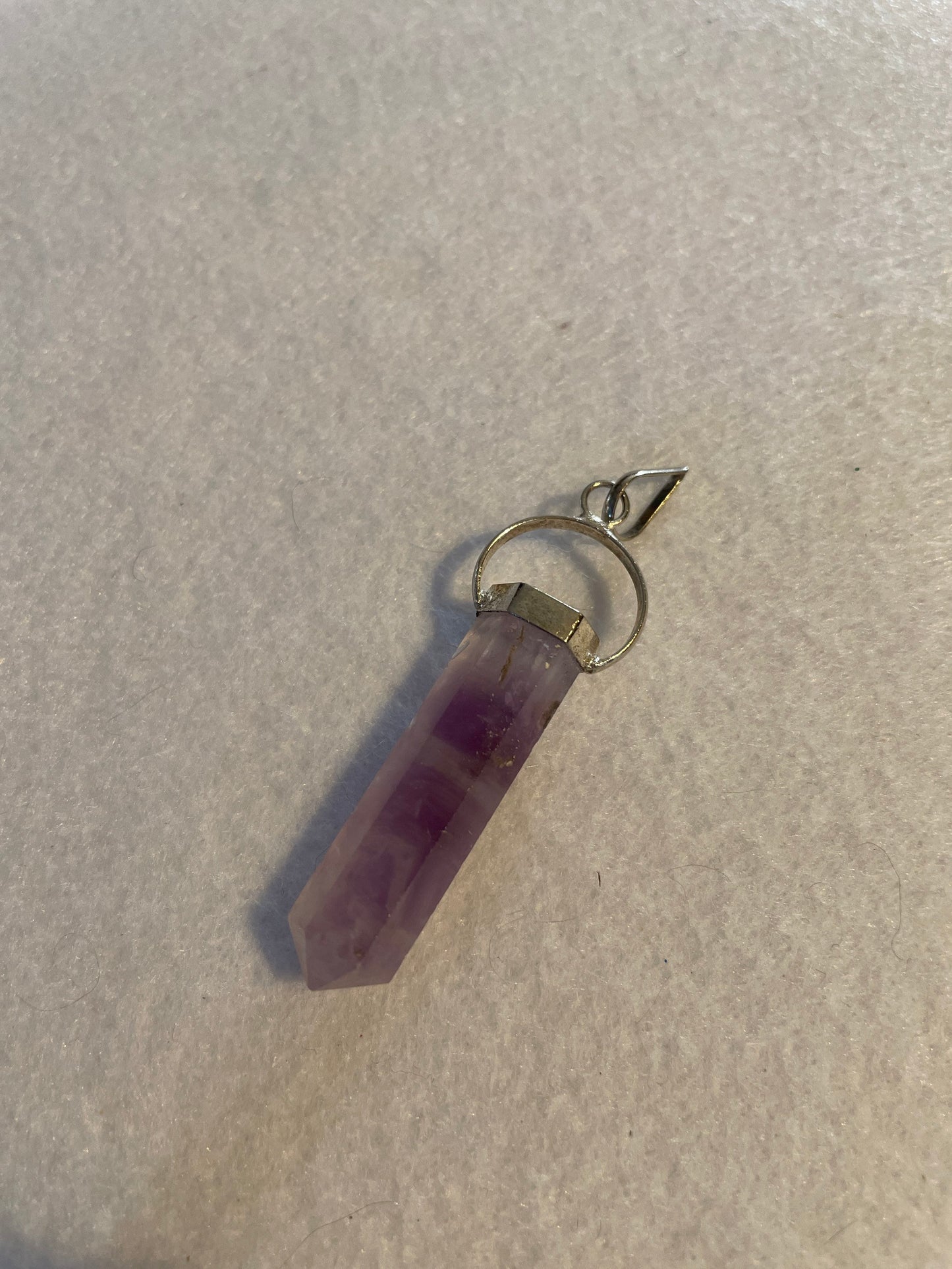 Gorgeous Amethyst Point Pendant is 1.5” and is attached to precious silver.