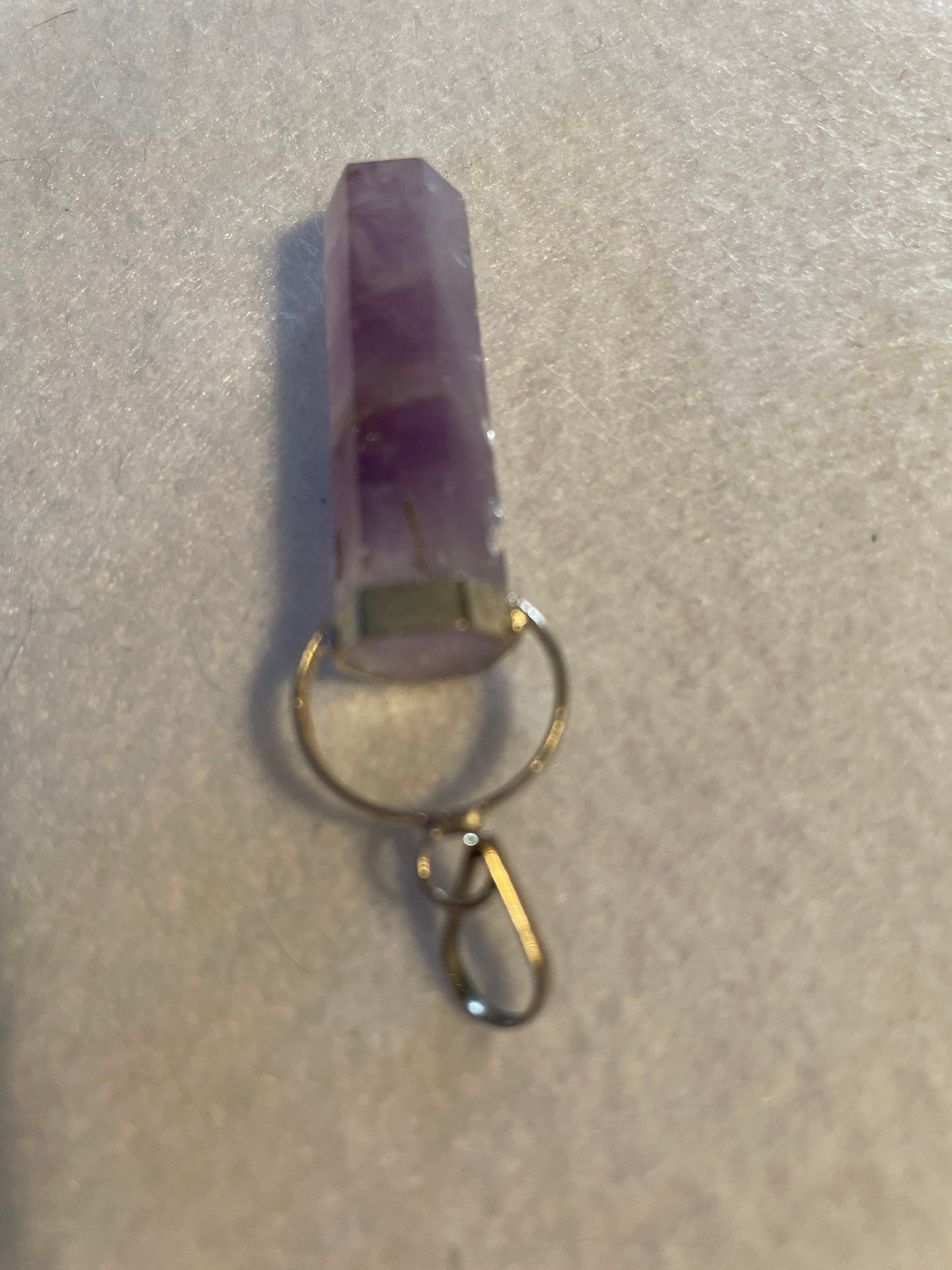 Gorgeous Amethyst Point Pendant is 1.5” and is attached to precious silver.