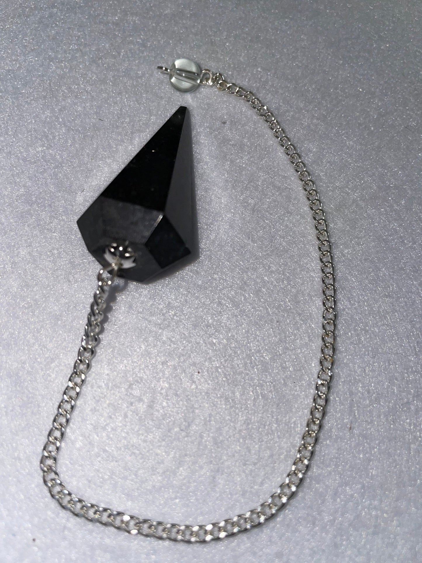 Black Obsidian Pendulum is 1.65” and with chain is 8.5”