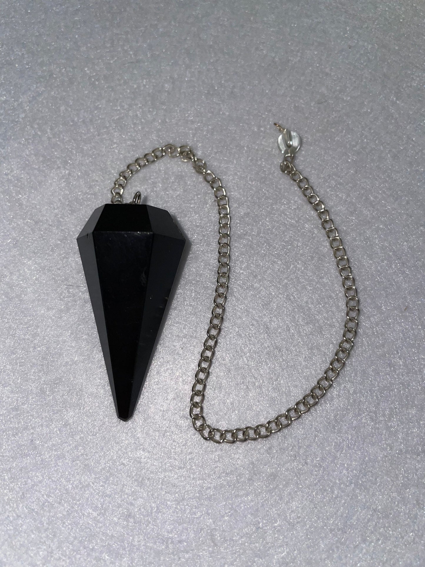 Beautiful Black Obsidian Pendulum is 1.75” and with chain is 9”.25”