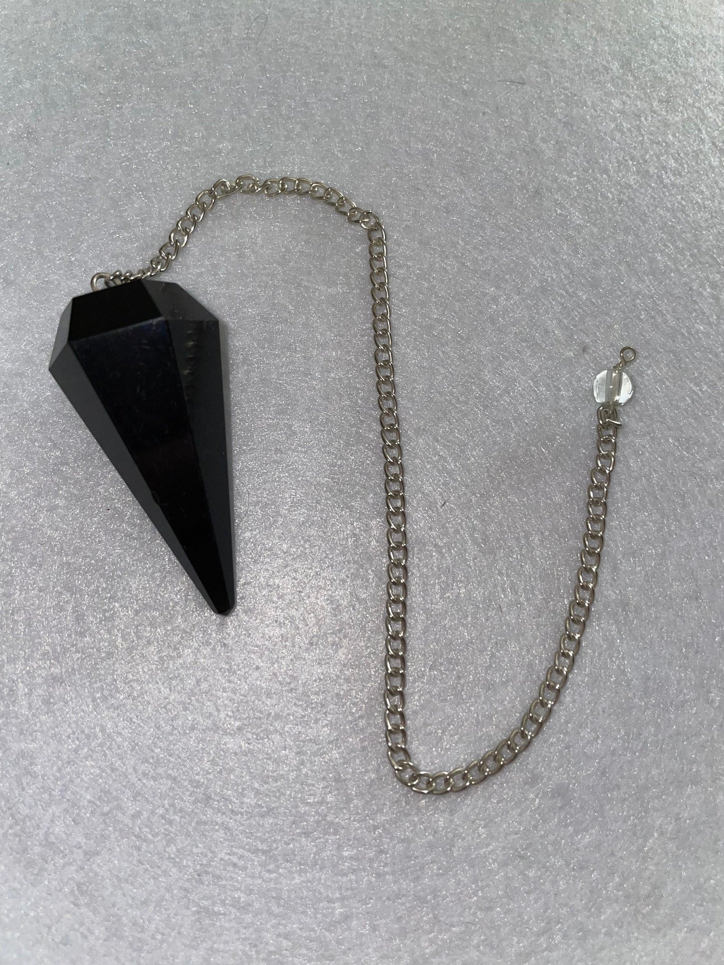 Beautiful Black Obsidian Pendulum is 1.75” and with chain is 9”.25”
