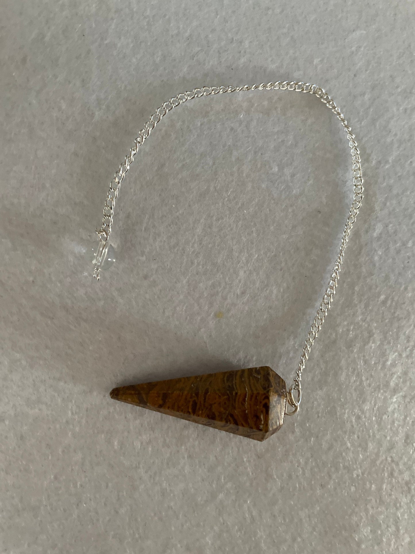 beautiful Yellow Jasper Pendulum is 1.50” and with the chain it is approximately 8”