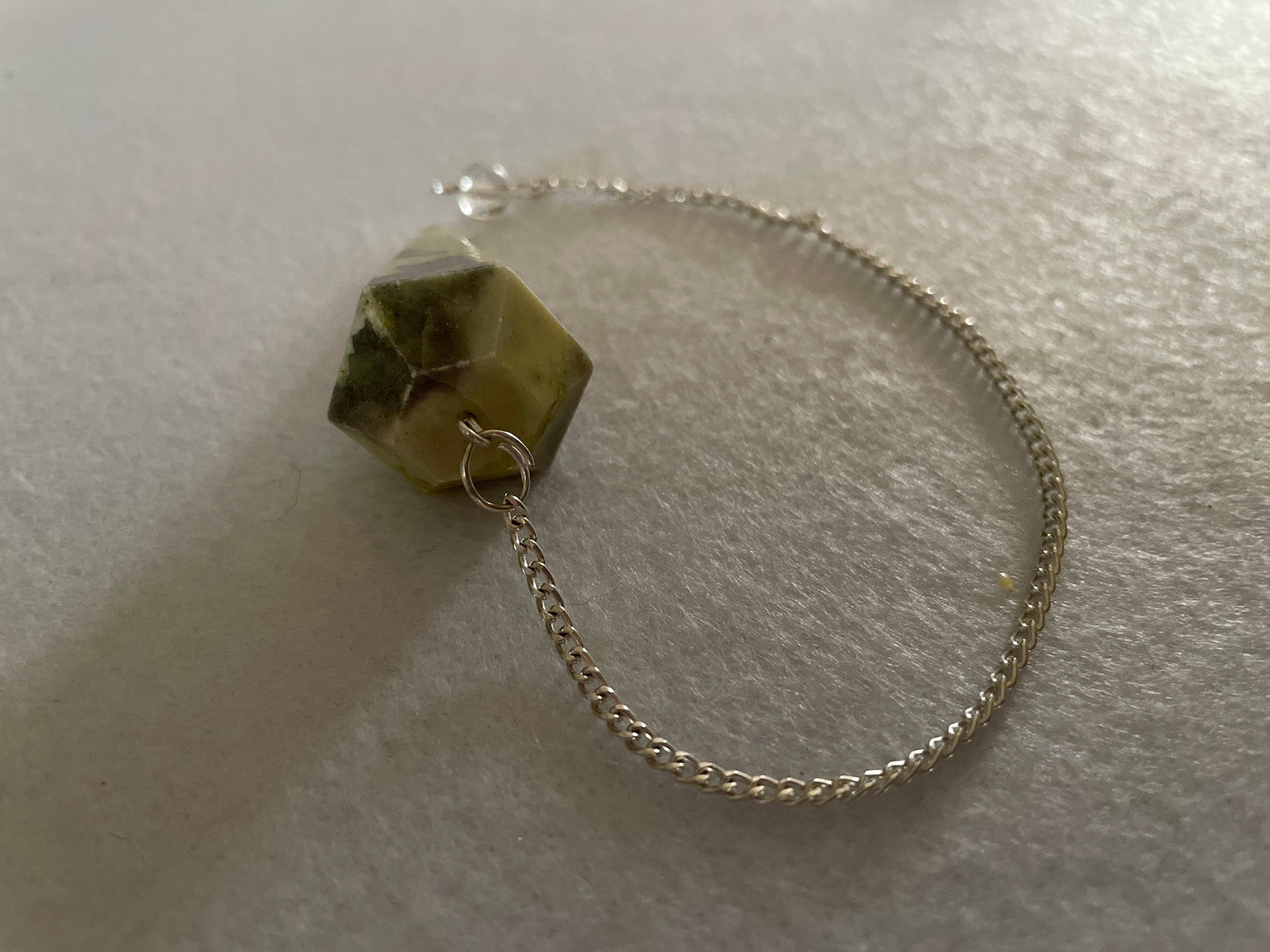 Beautiful Serpentine Pendulum is 1.85” and with chain is 8.5”
