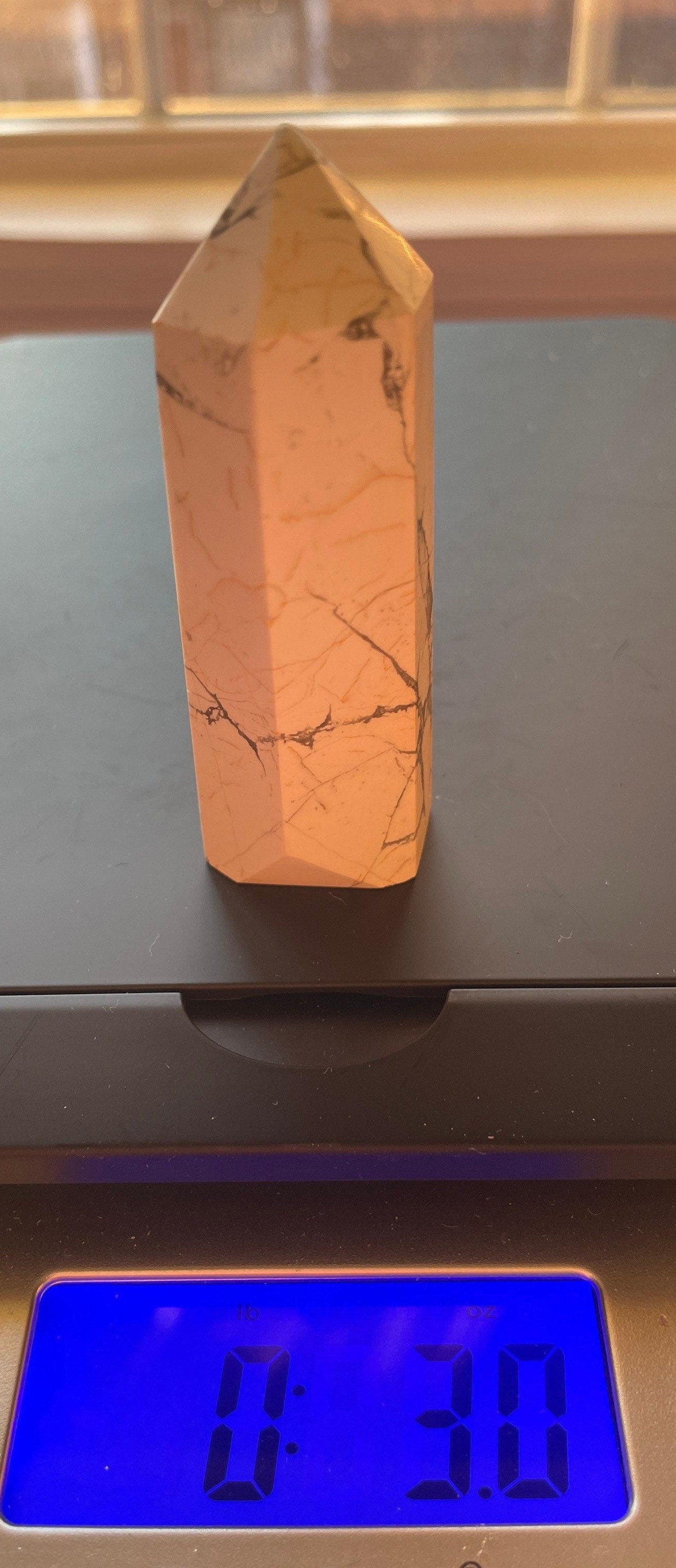 Awesome Howlite point crystal with beautiful cuts