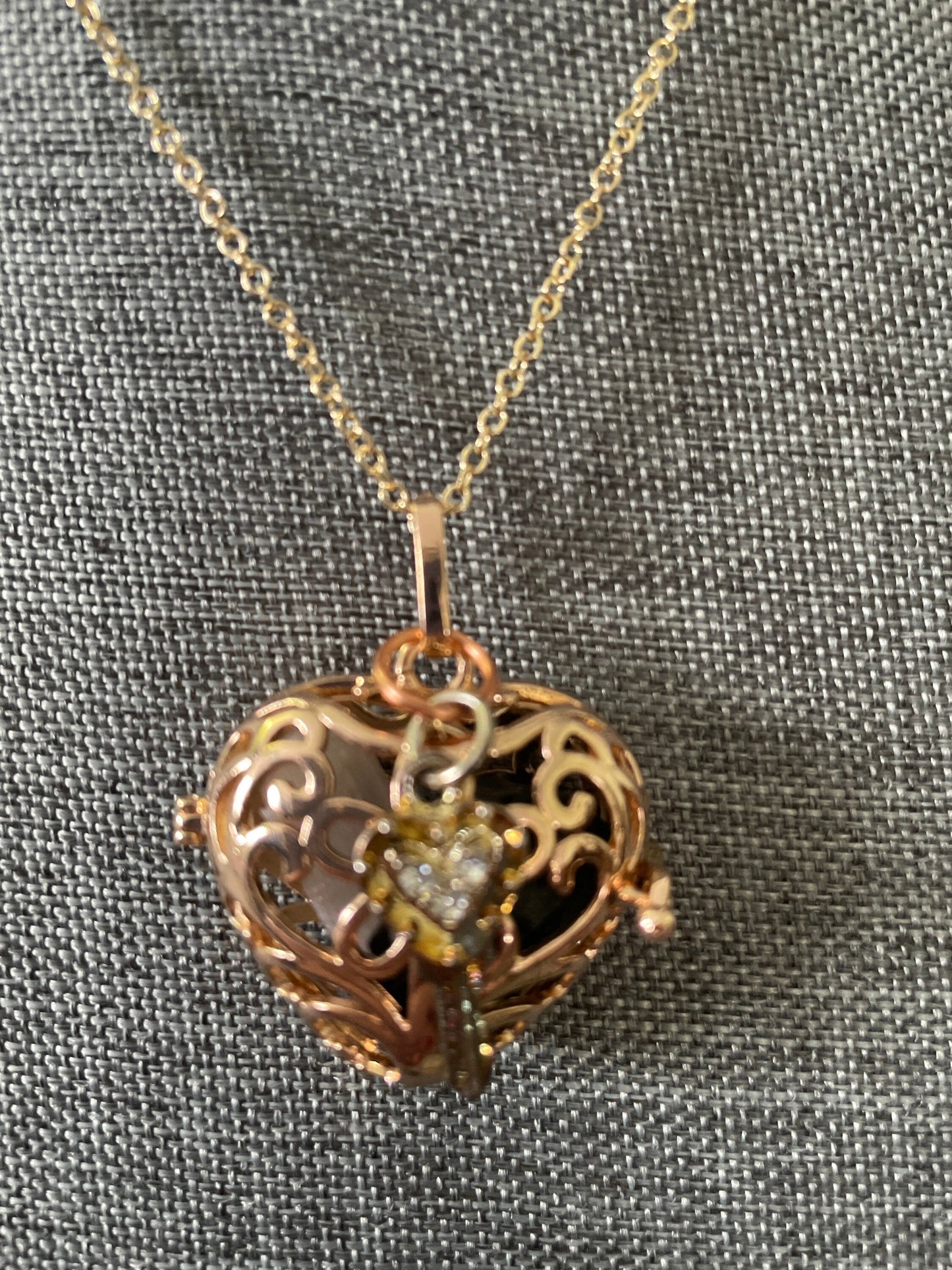 Gold locket filled with crystals on 16+” gold chain