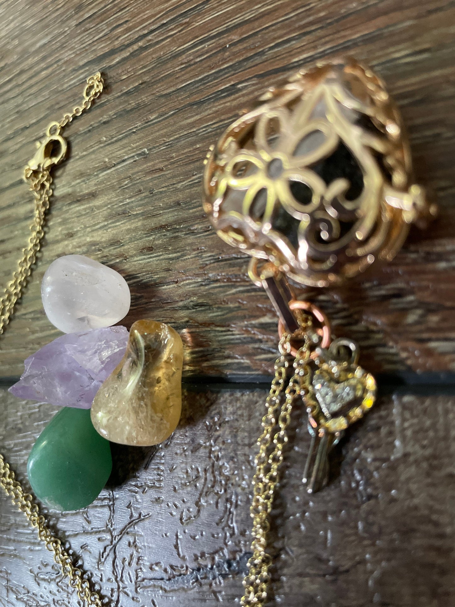 Gold locket filled with crystals on 16+” gold chain