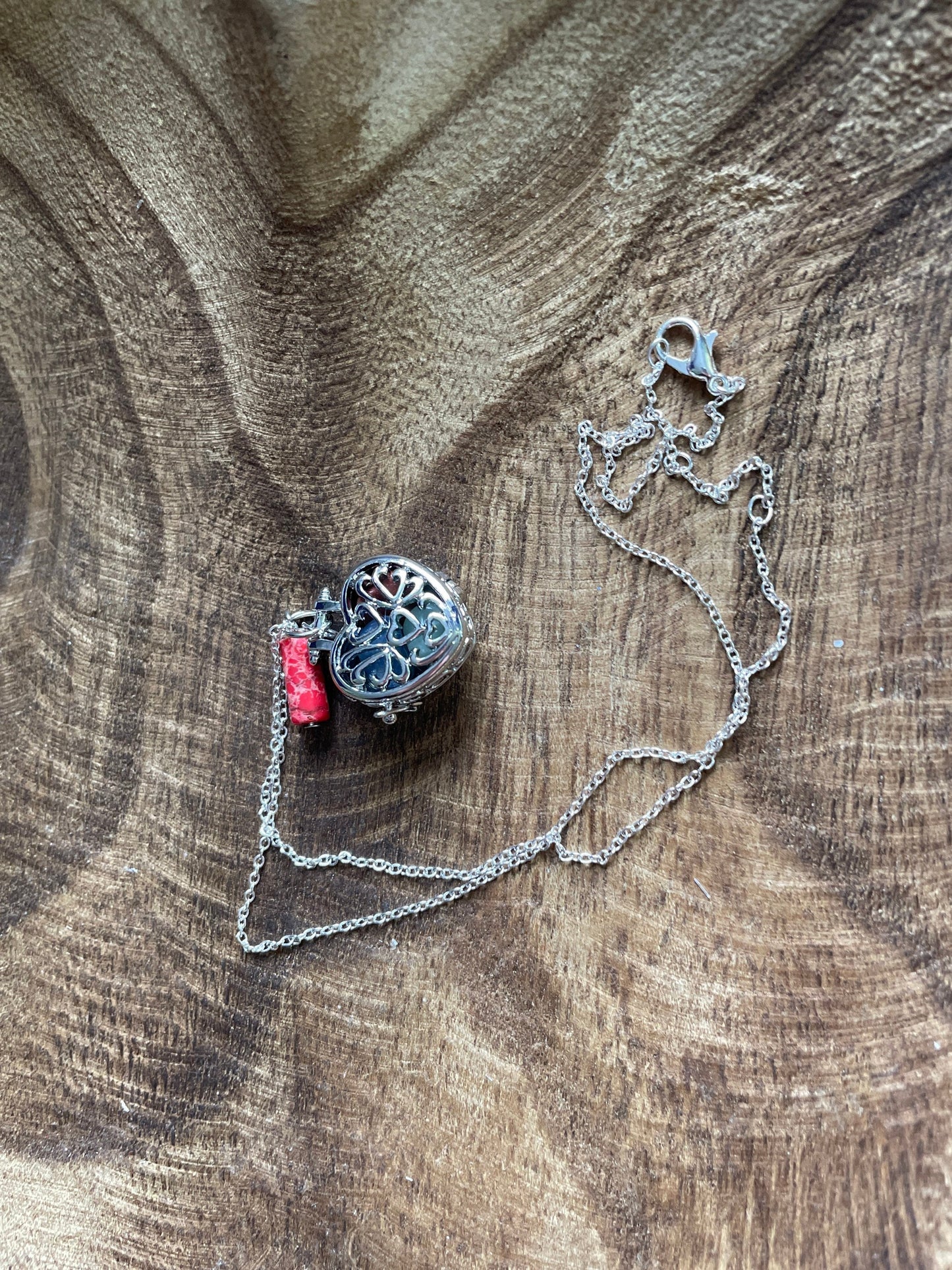 Silver stainless steel locket filled with crystals on 16+” silver stainless steel chain