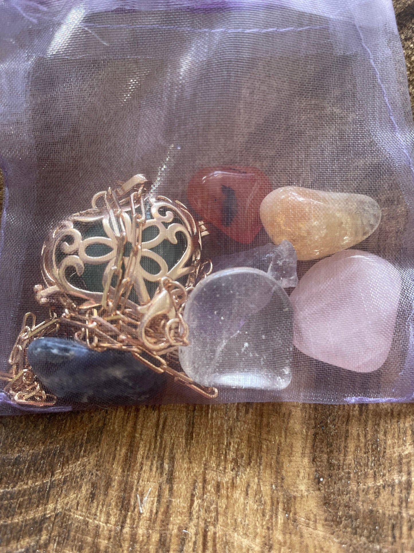 Gold locket with 7 interchangeable crystals on 16+”gold chain