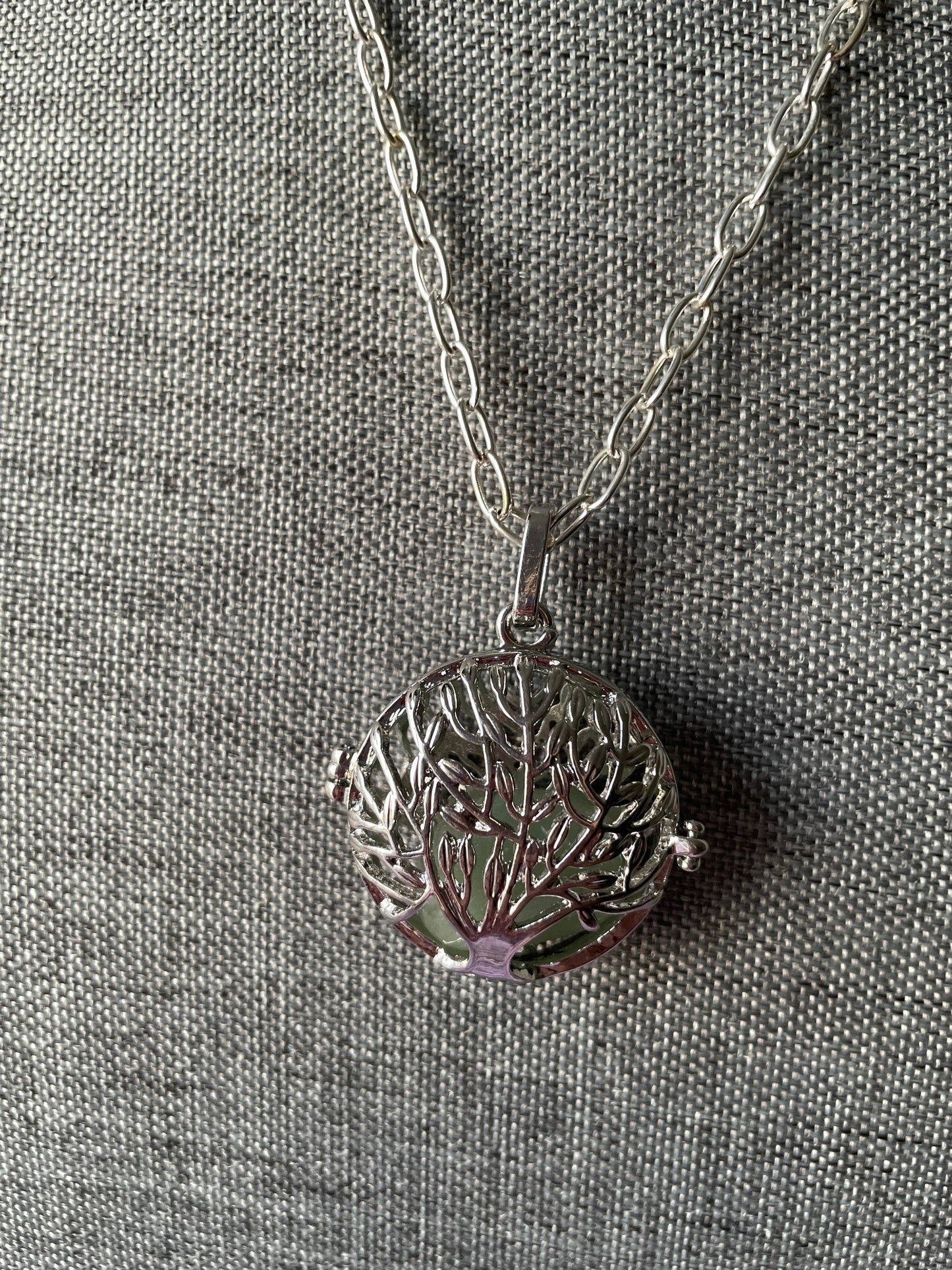 Silver round Tree of Life locket with 7 interchangeable crystals on 16+ inch silver plated chain
