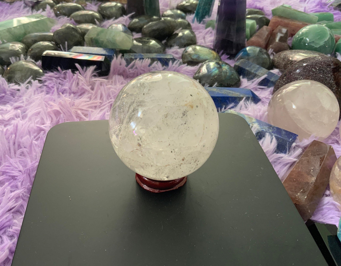 Beautiful 12.5 ounce clear quartz sphere crystal ball with wooden stand