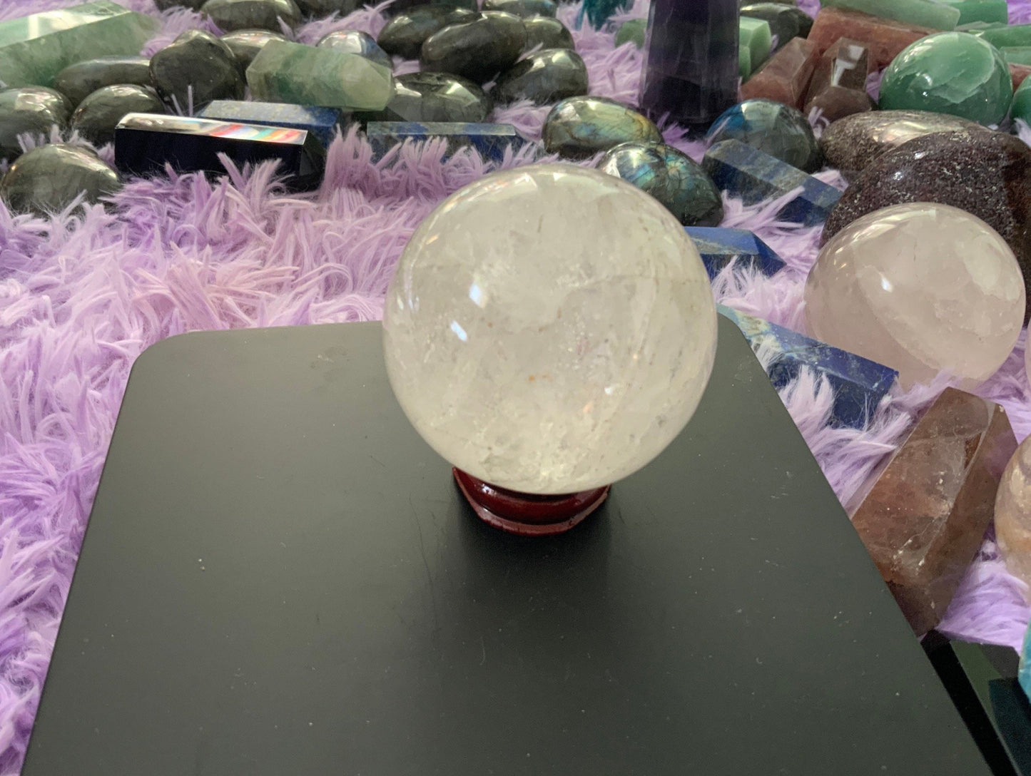 Beautiful 12.5 ounce clear quartz sphere crystal ball with wooden stand