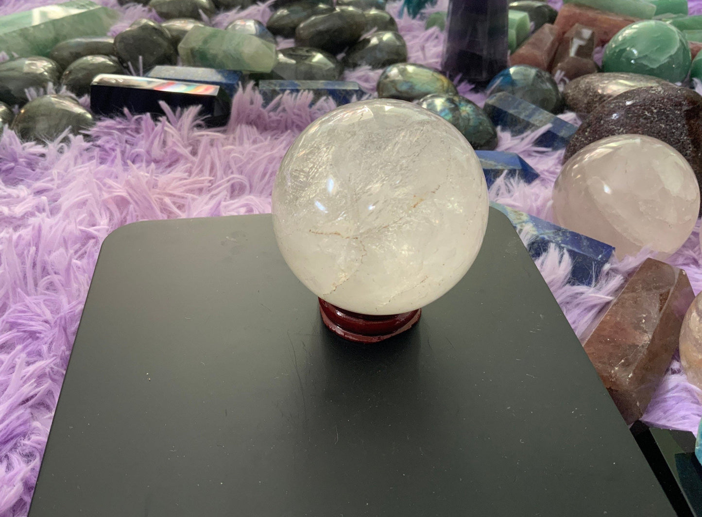 Beautiful 12.5 ounce clear quartz sphere crystal ball with wooden stand