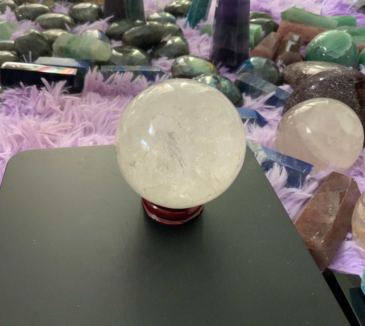 Beautiful 12.5 ounce clear quartz sphere crystal ball with wooden stand