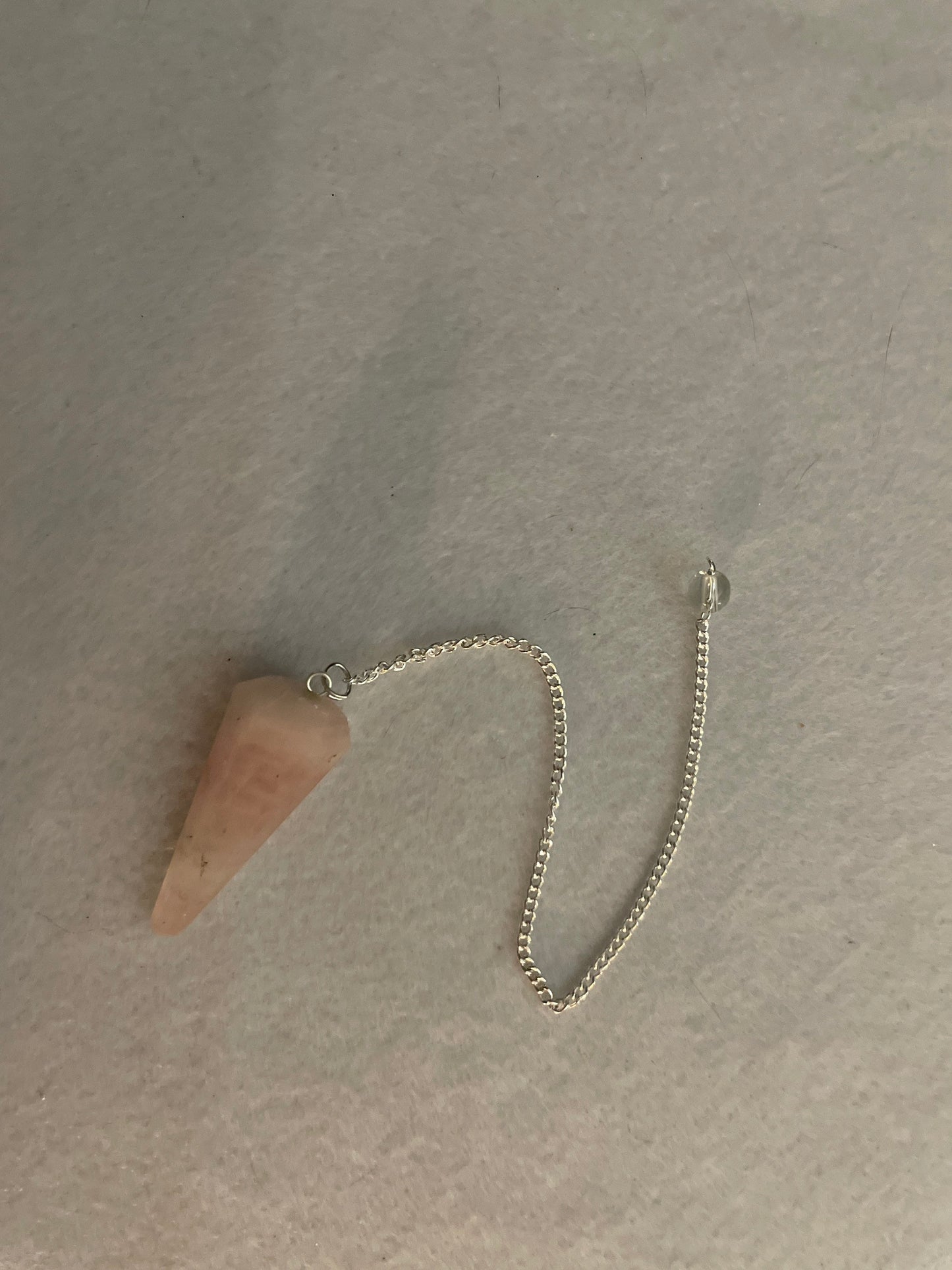 This beautiful Rose Quartz Pendulum is 1.65” and with chain is 8”