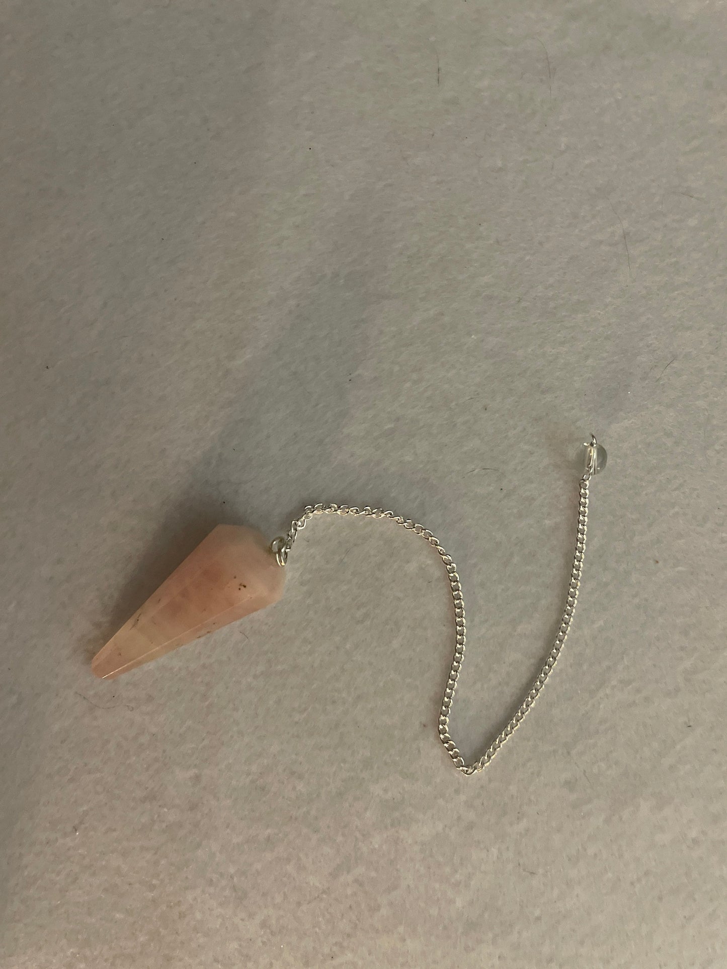 This beautiful Rose Quartz Pendulum is 1.65” and with chain is 8”
