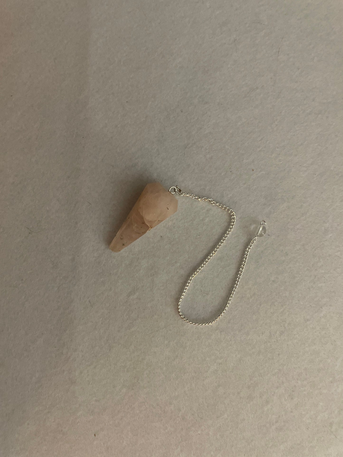 This beautiful Rose Quartz Pendulum is 1.65” and with chain is 8.25”