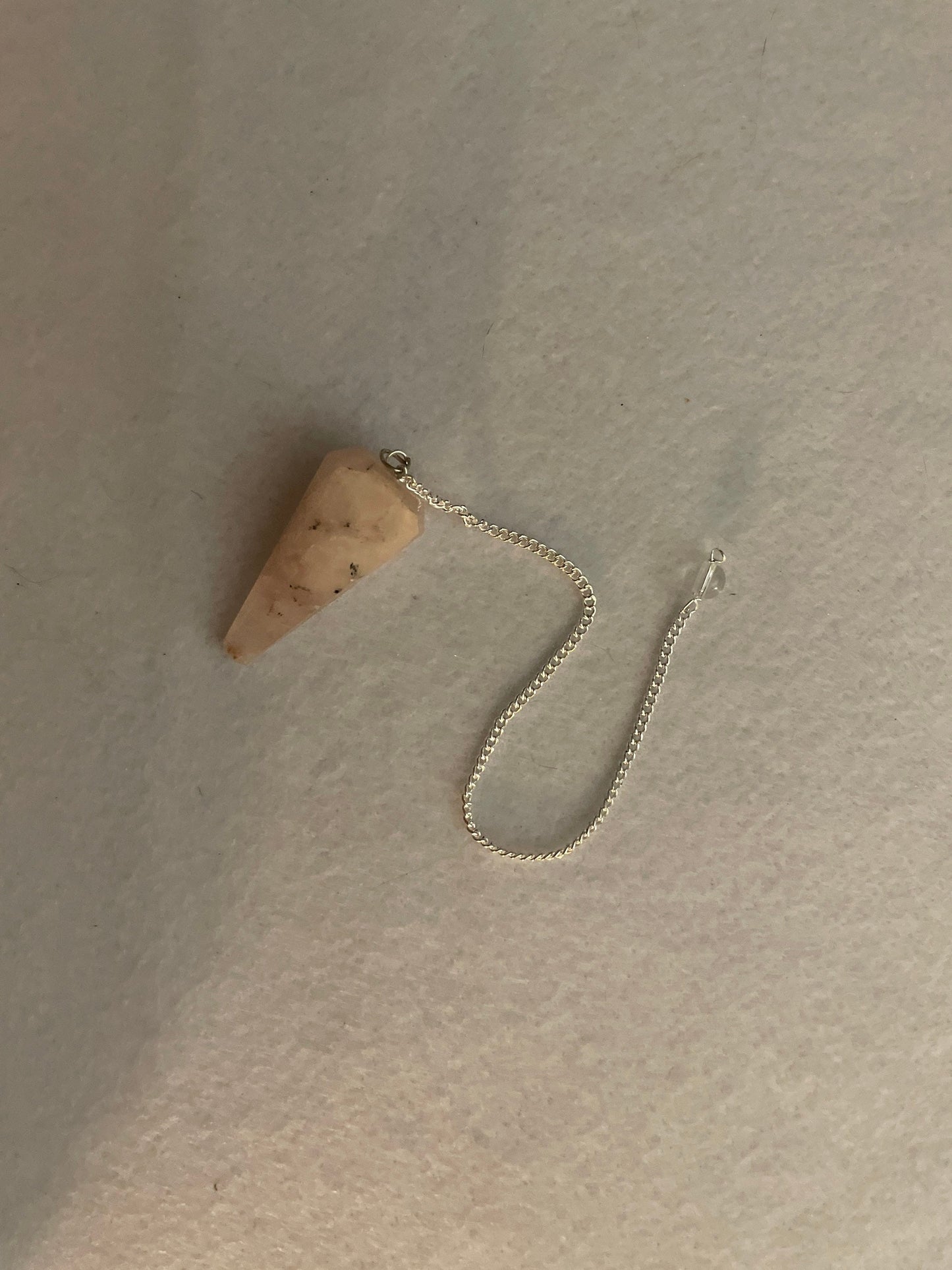 This beautiful Rose Quartz Pendulum is 1.65” and with chain is 8.25”
