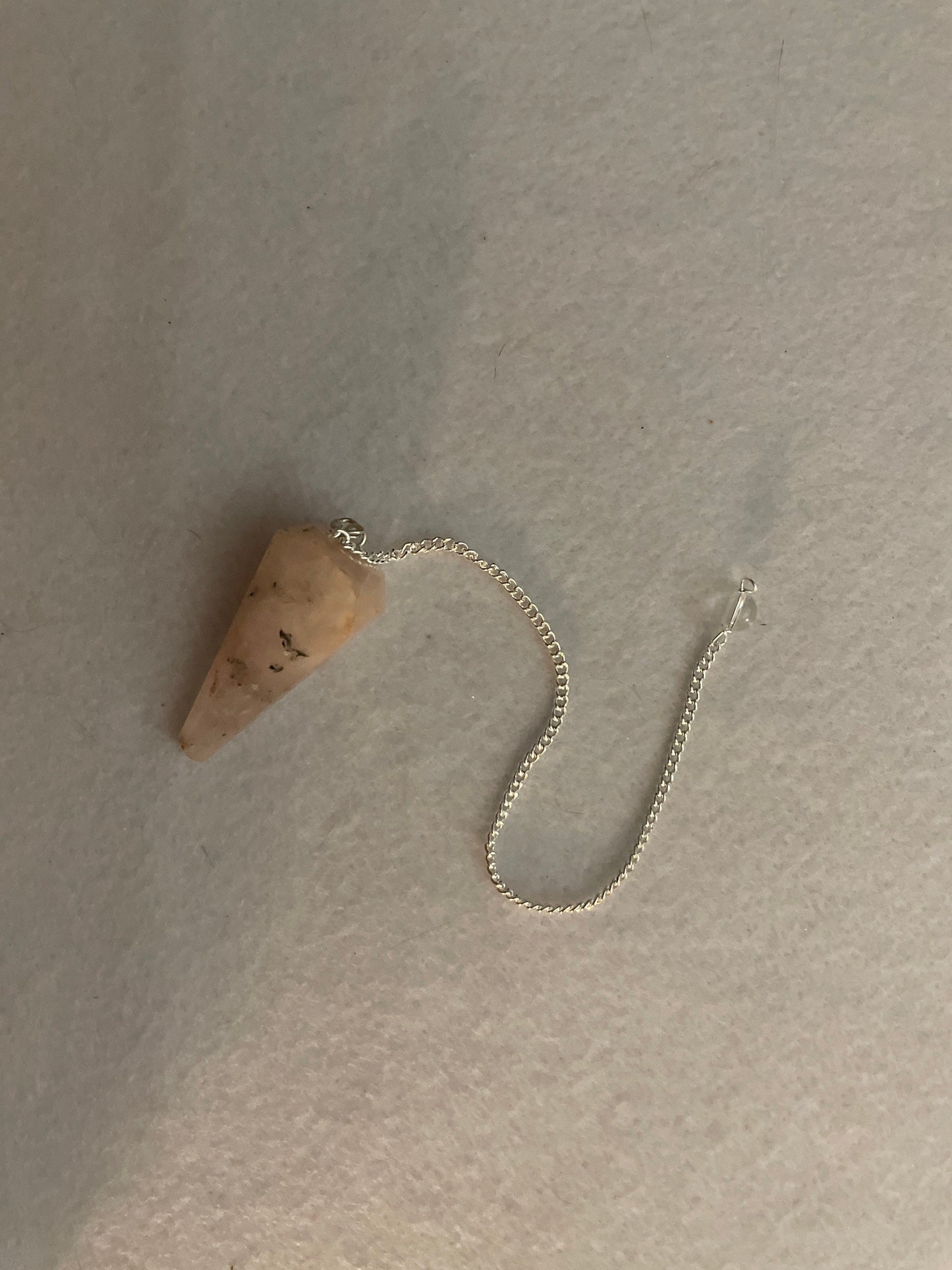 This beautiful Rose Quartz Pendulum is 1.65” and with chain is 8.25”