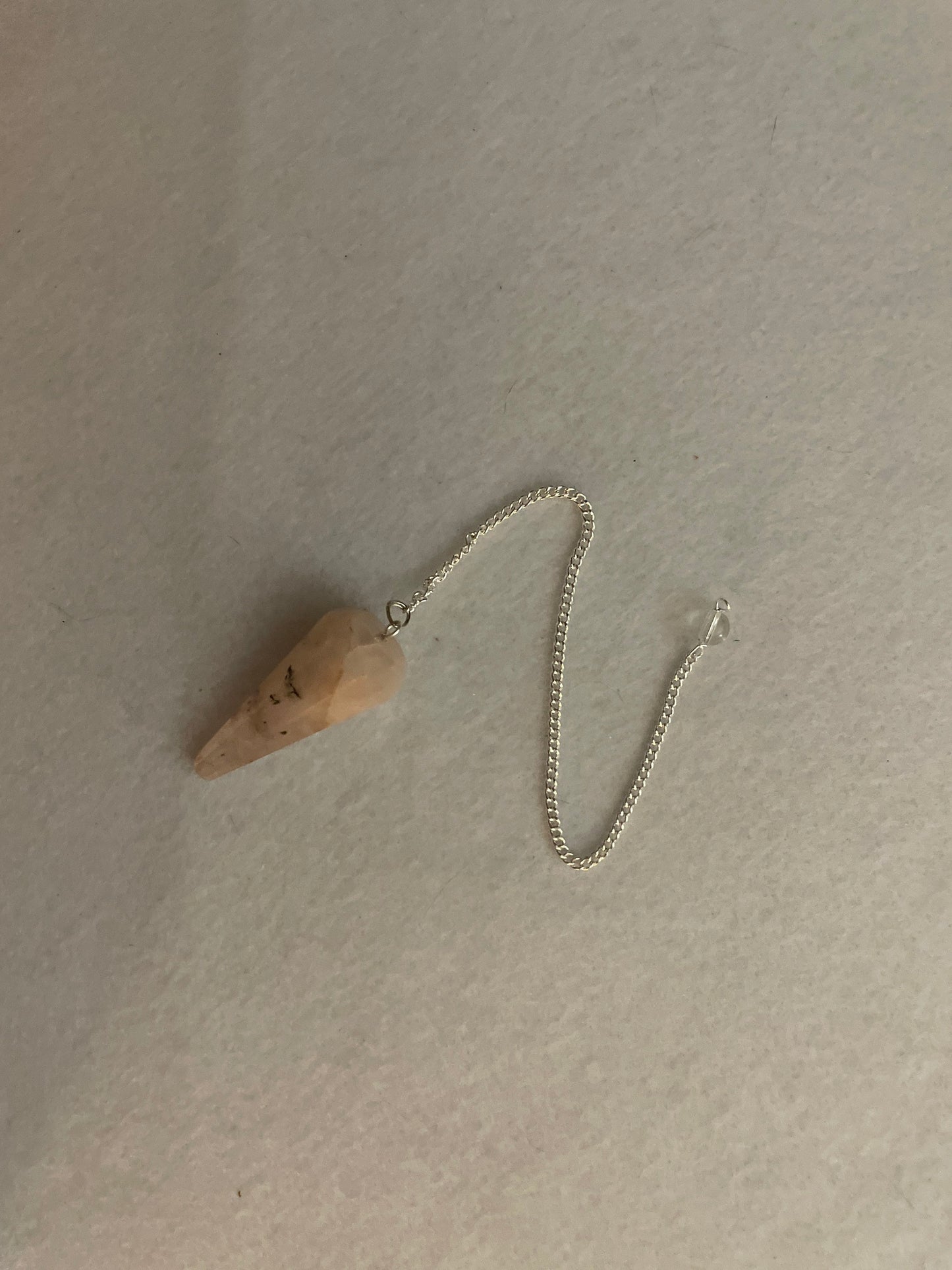 This beautiful Rose Quartz Pendulum is 1.65” and with chain is 8.25”