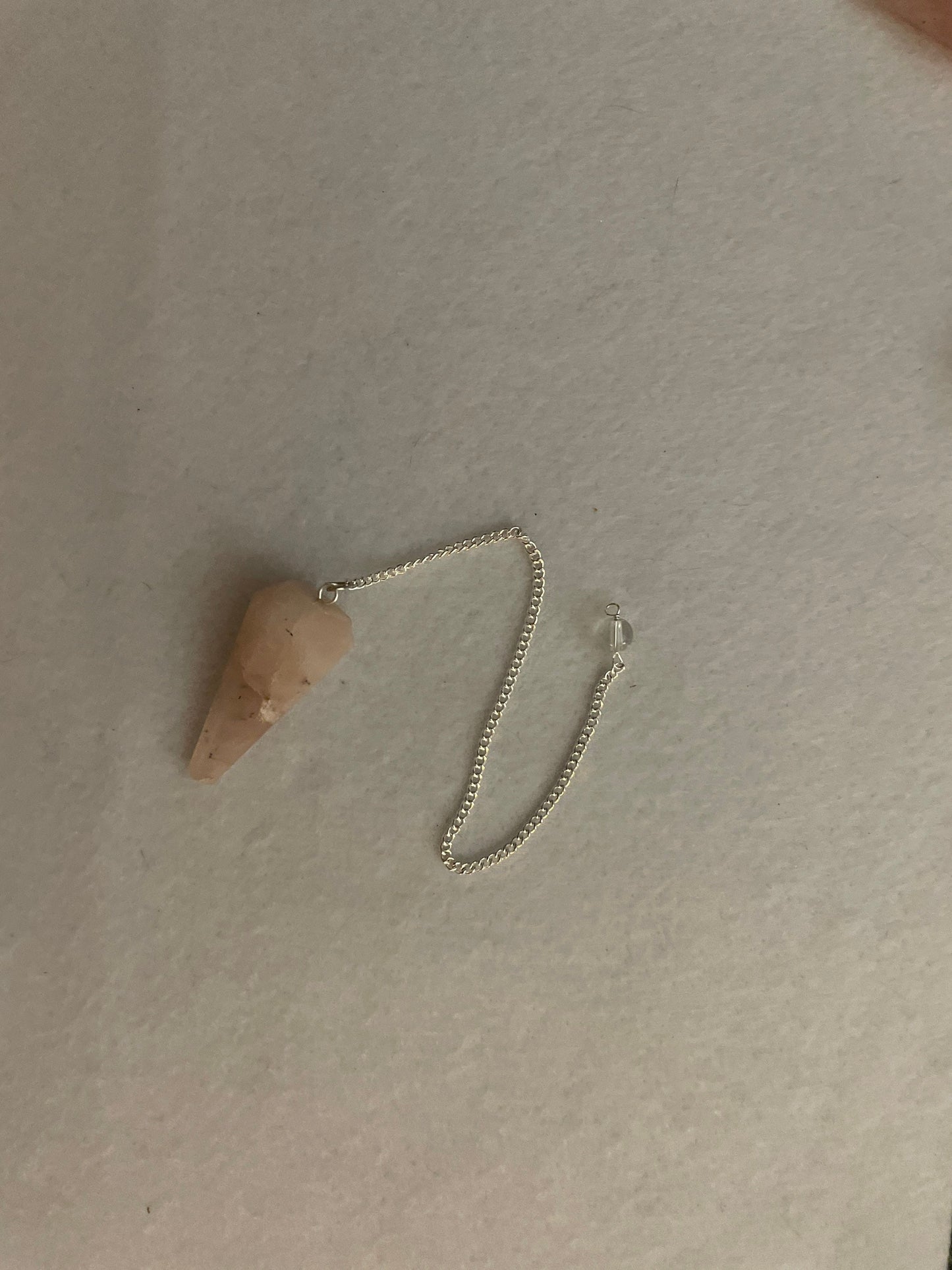 This beautiful Rose Quartz Pendulum is 1.65” and with chain is 8.25”