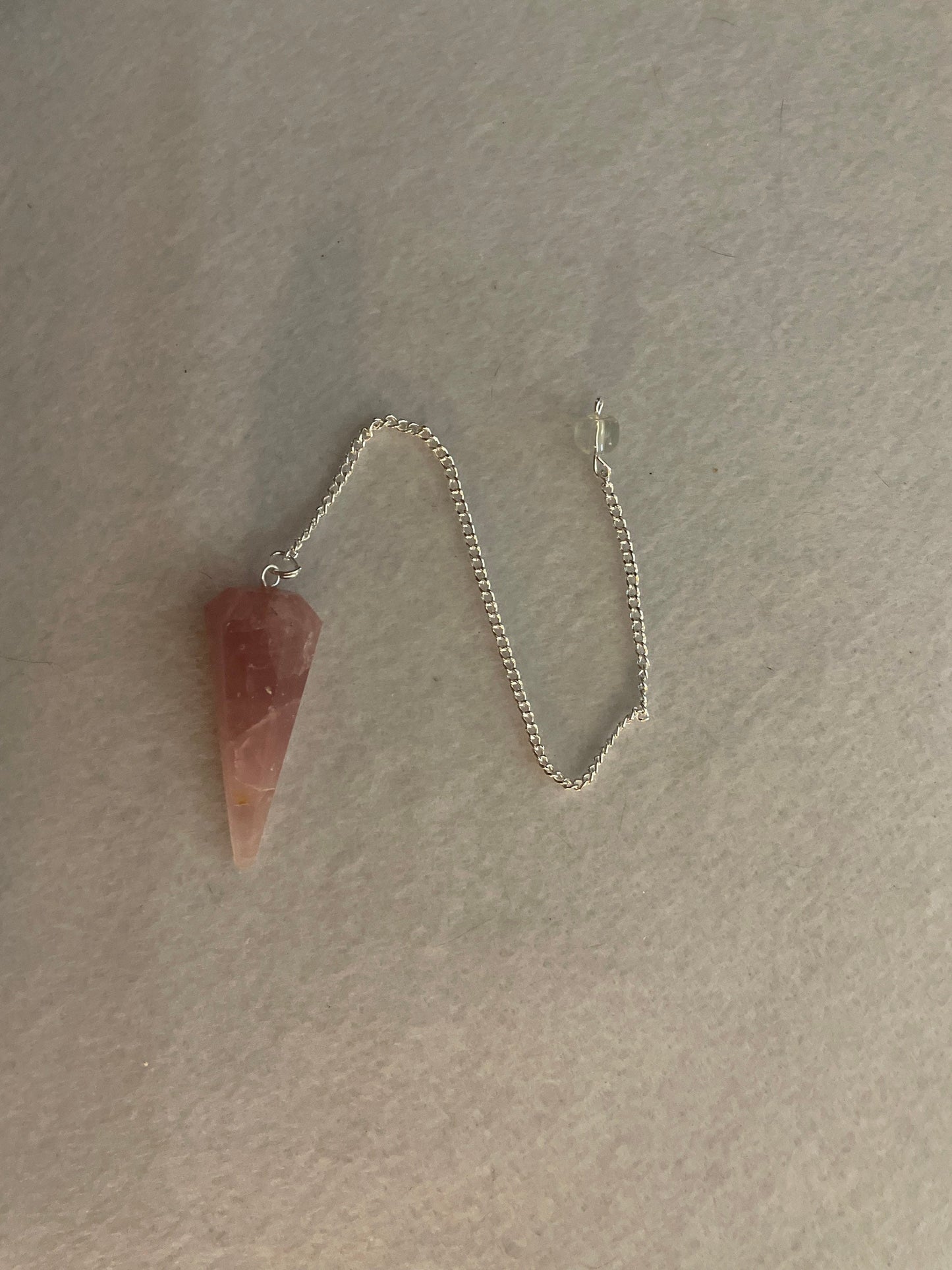 This beautiful Rose Quartz Pendulum is 1.75” and with chain is 8.50”