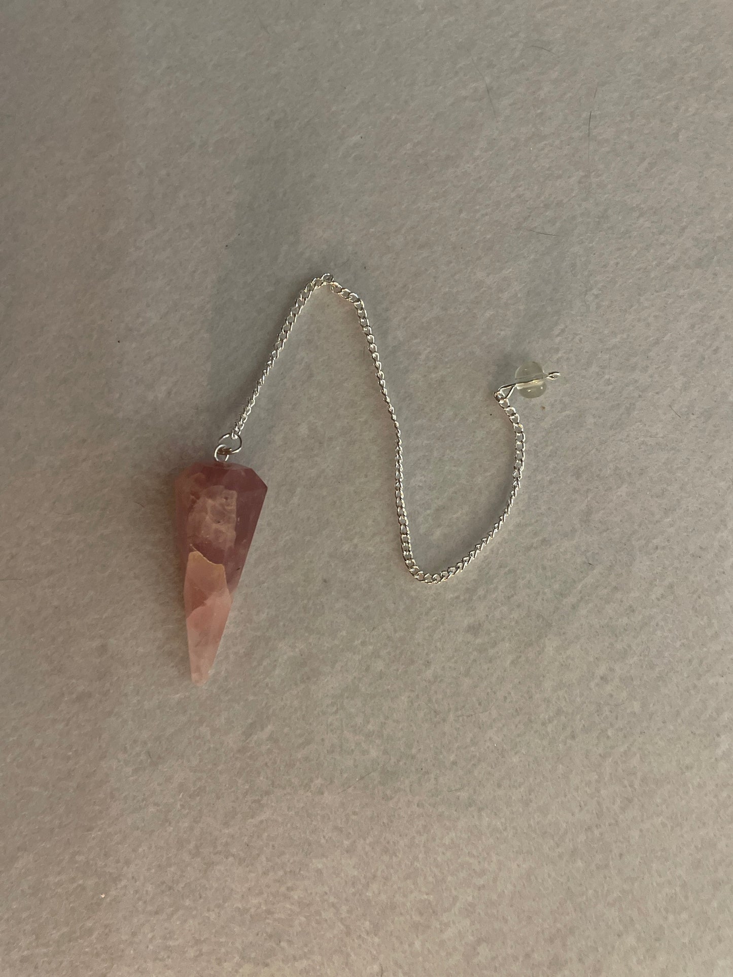 This beautiful Rose Quartz Pendulum is 1.75” and with chain is 8.50”