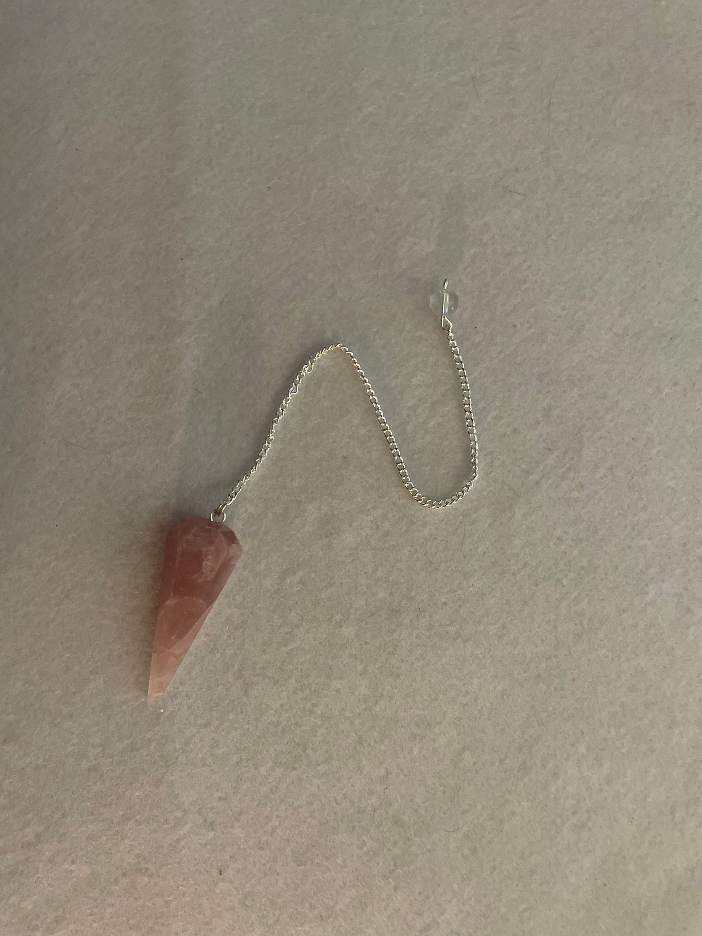 This beautiful Rose Quartz Pendulum is 1.75” and with chain is 8.50”