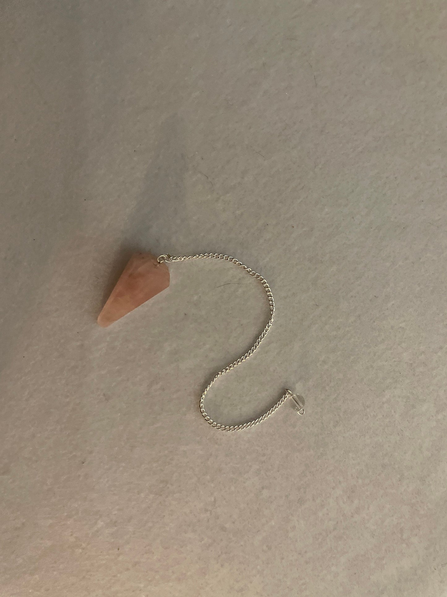 This beautiful Rose Quartz Pendulum is 1.5” and with chain is 8”